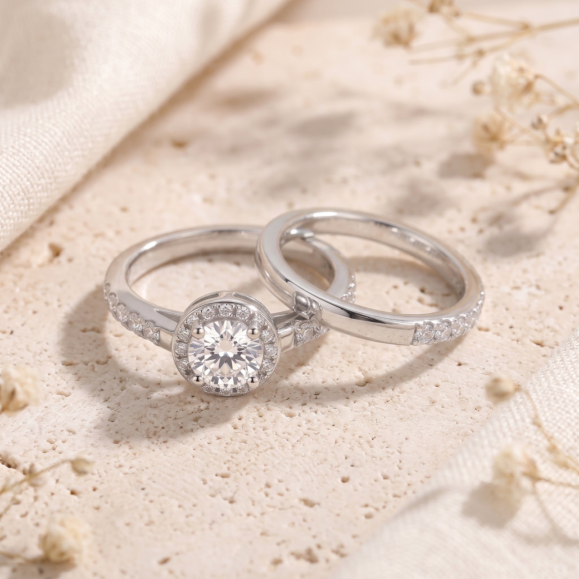 Close-up of Myrella sterling silver ring set featuring a round cut simulated diamond and halo setting.