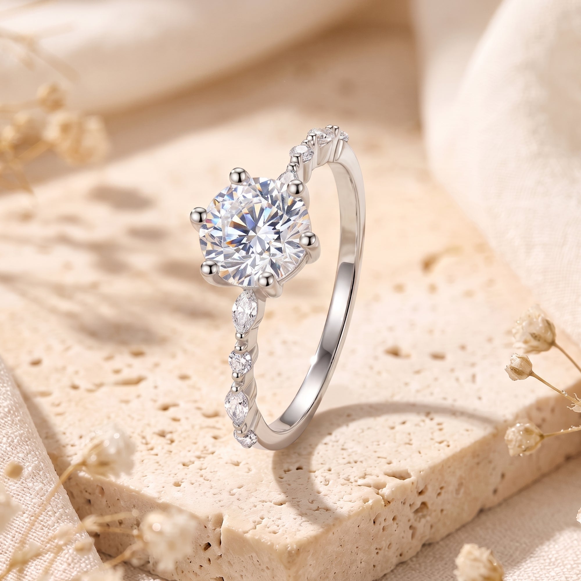 Side view of the Belise sterling silver ring featuring a round-cut stone and marquise-accented band.