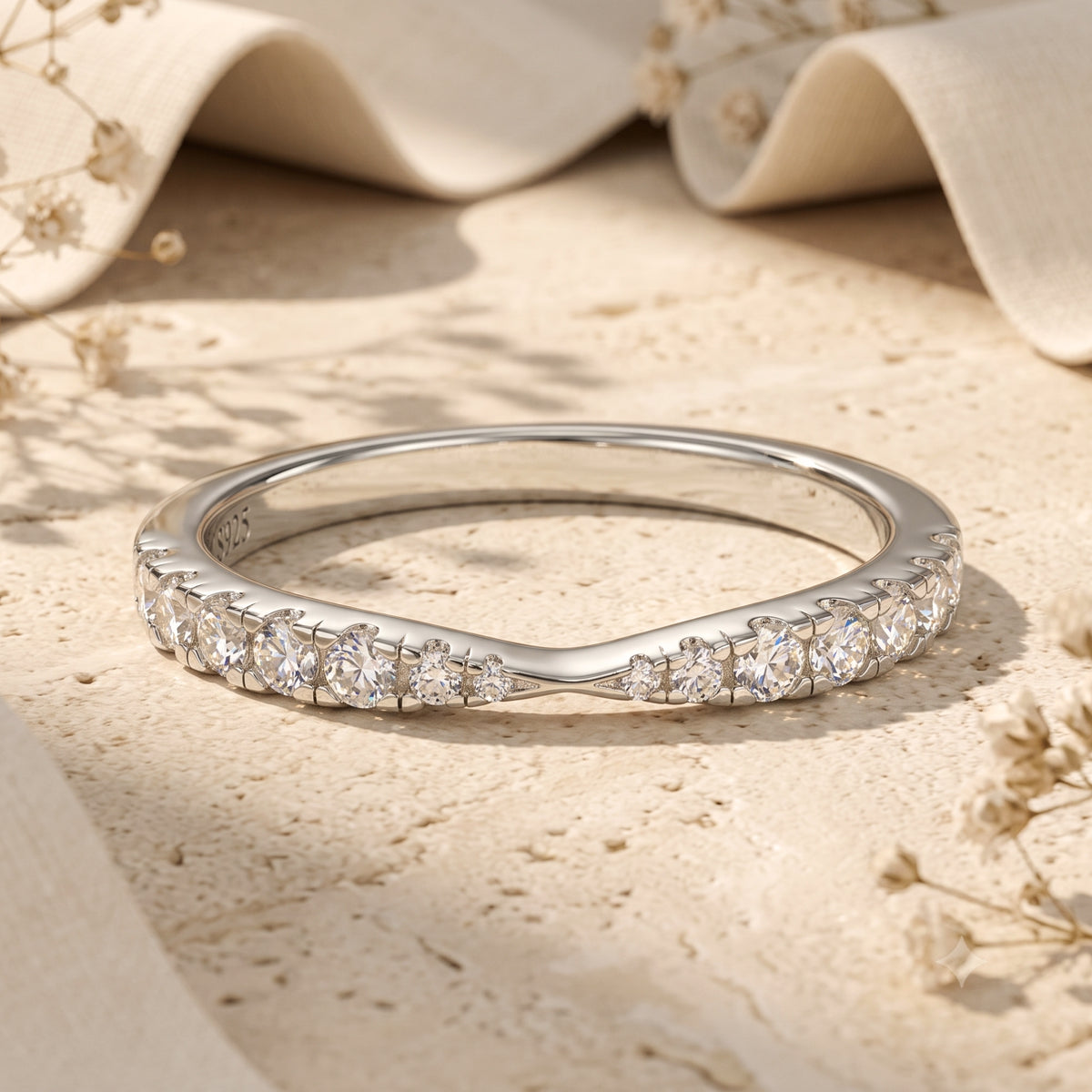 Macro view of the Fleuriana silver wave ring showing the brilliant round-cut simulated diamond setting.