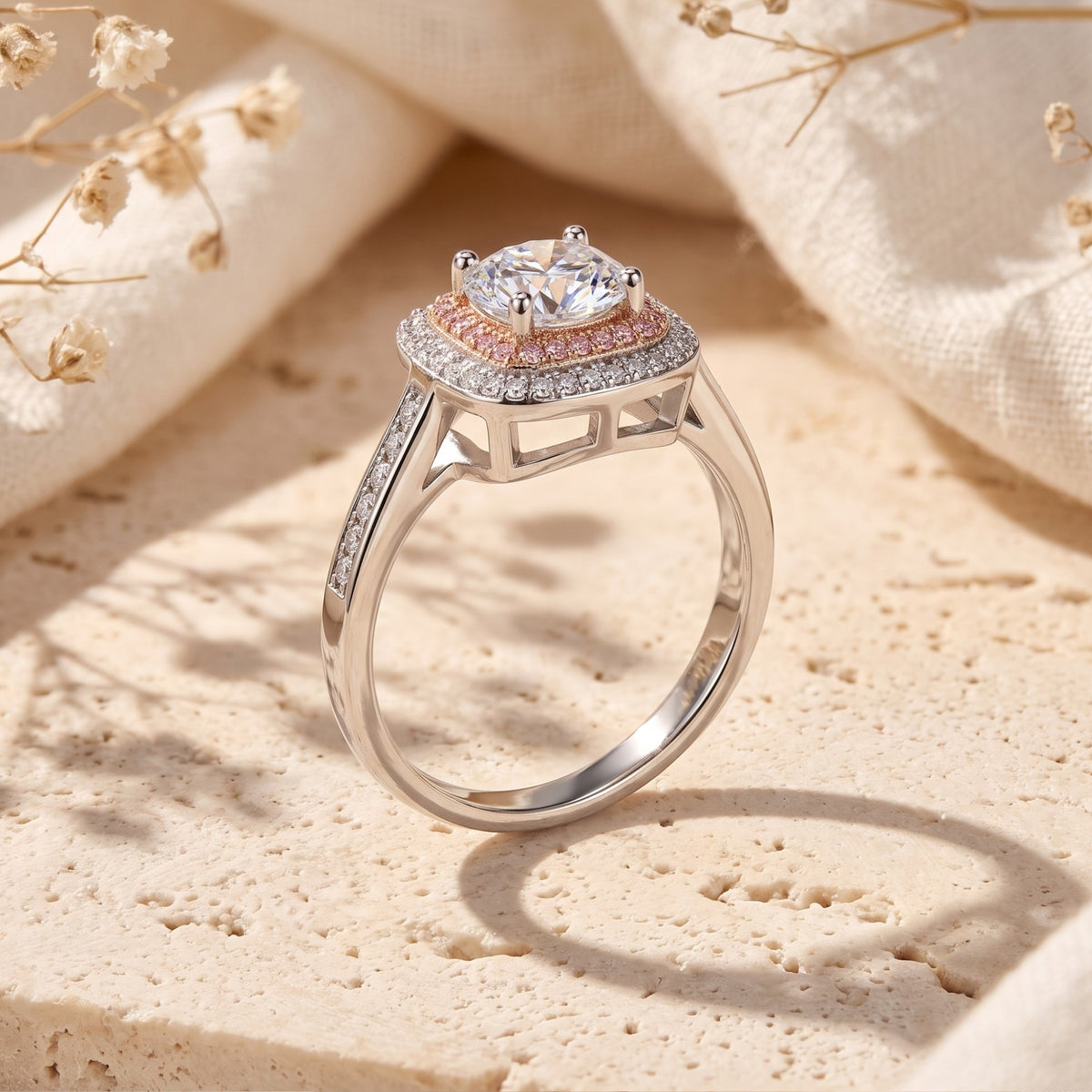 Side view of the silver dual-halo ring showing its elevated basket setting, open gallery, and stone-set shoulder accents.