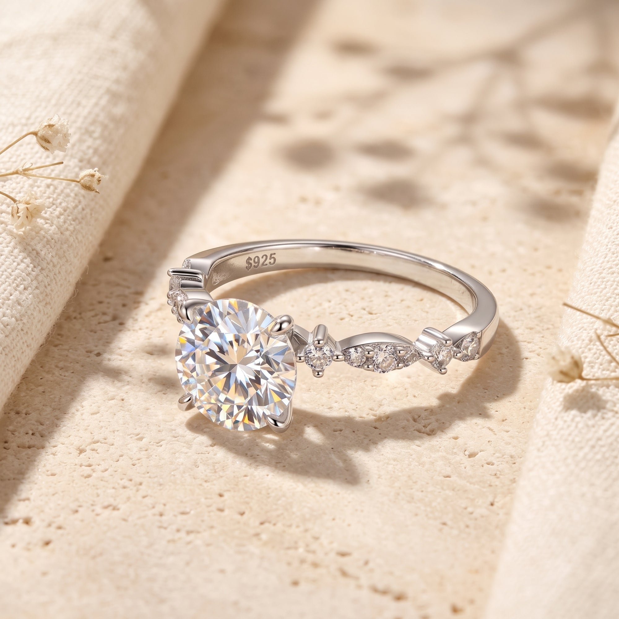 Close-up of S925 sterling silver hallmark and round-cut simulated diamond setting.