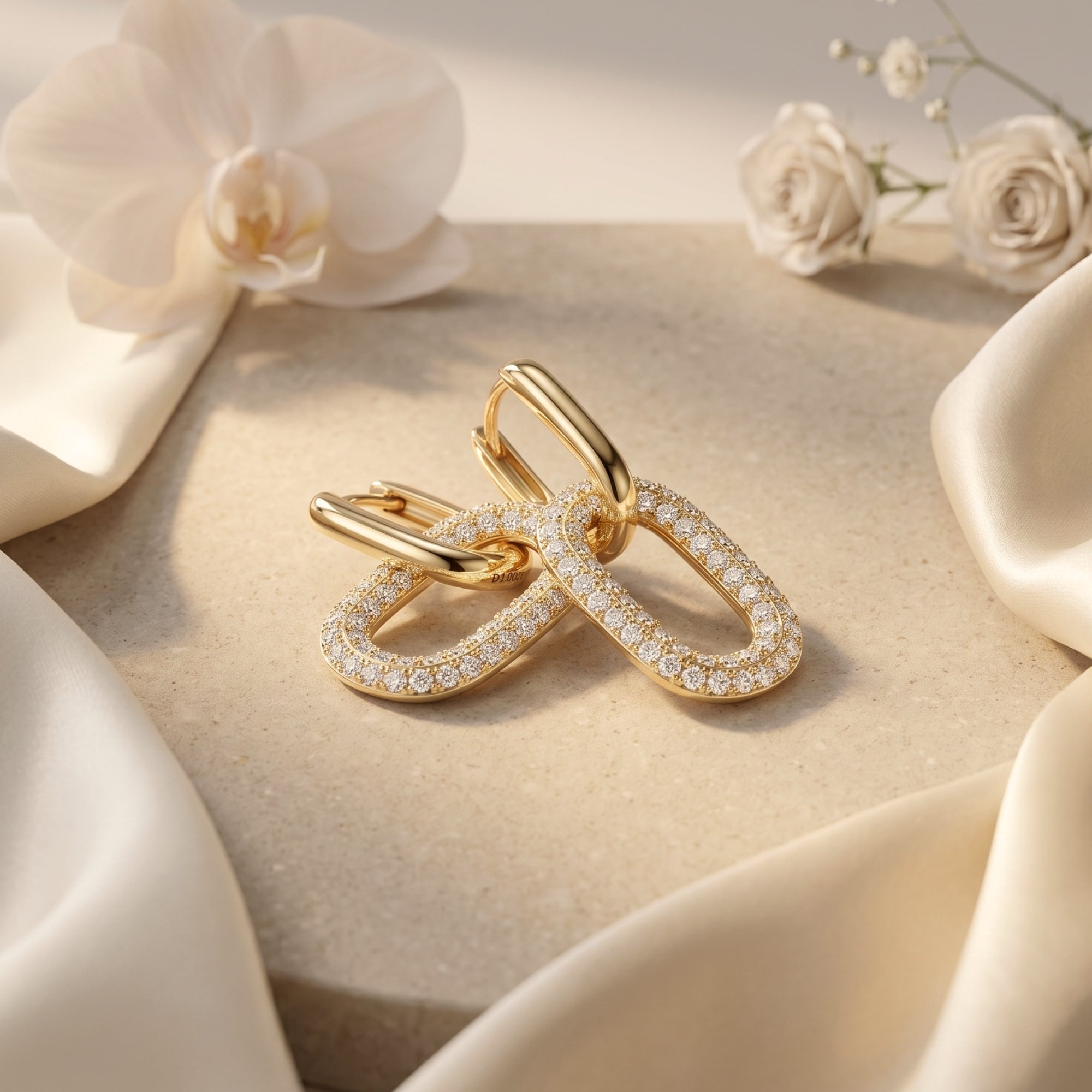 Gold vermeil moissanite double-link drop earrings styled with white flowers.