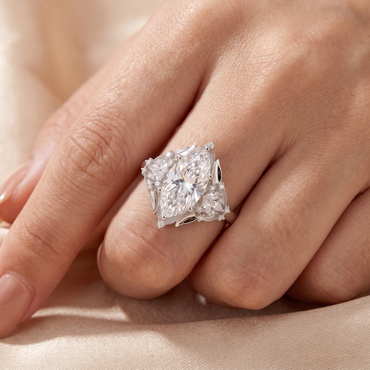 Sterling silver marquise simulated diamond ring on finger showing size.