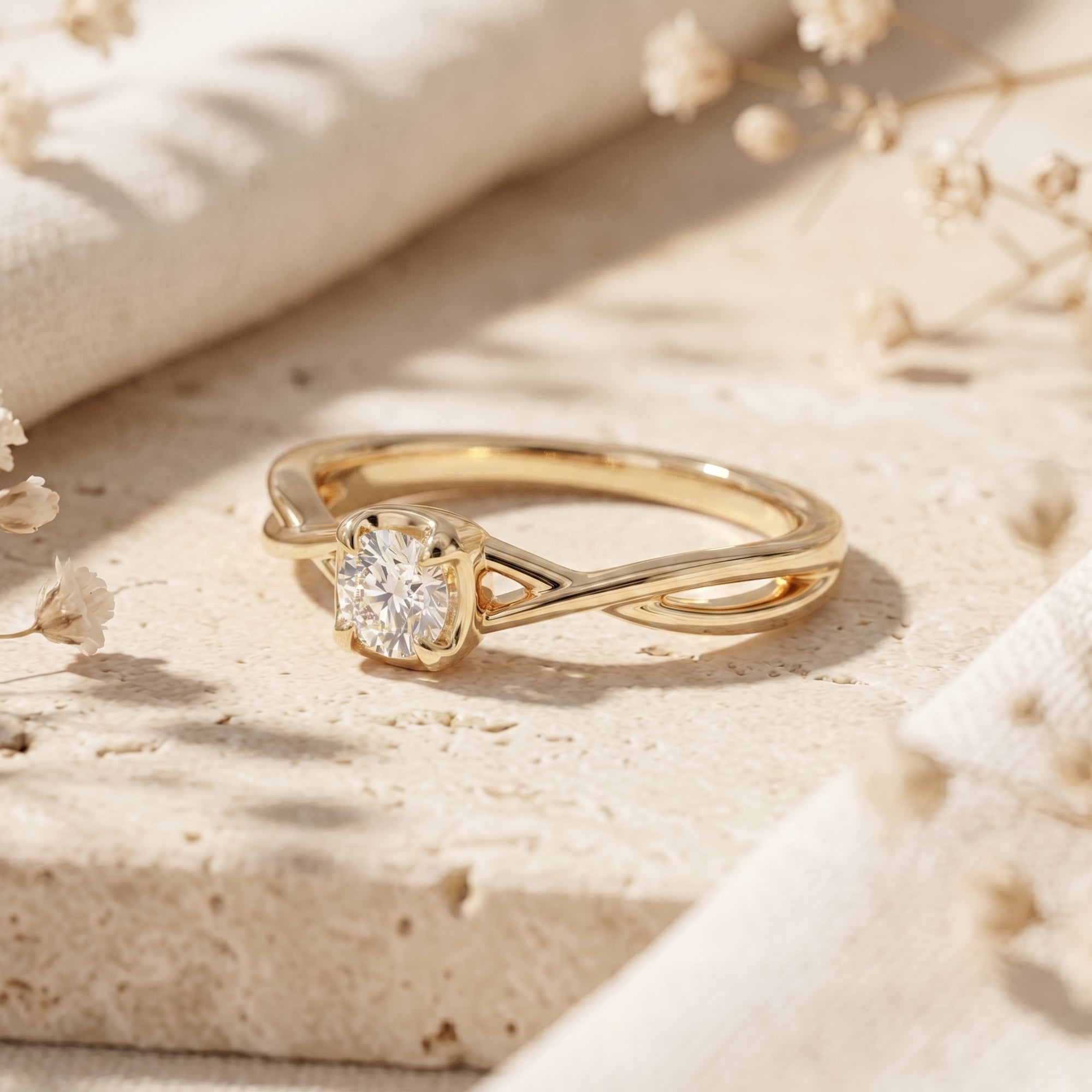 Side view of a yellow gold promise ring with a round moissanite and twisted band on a stone surface.