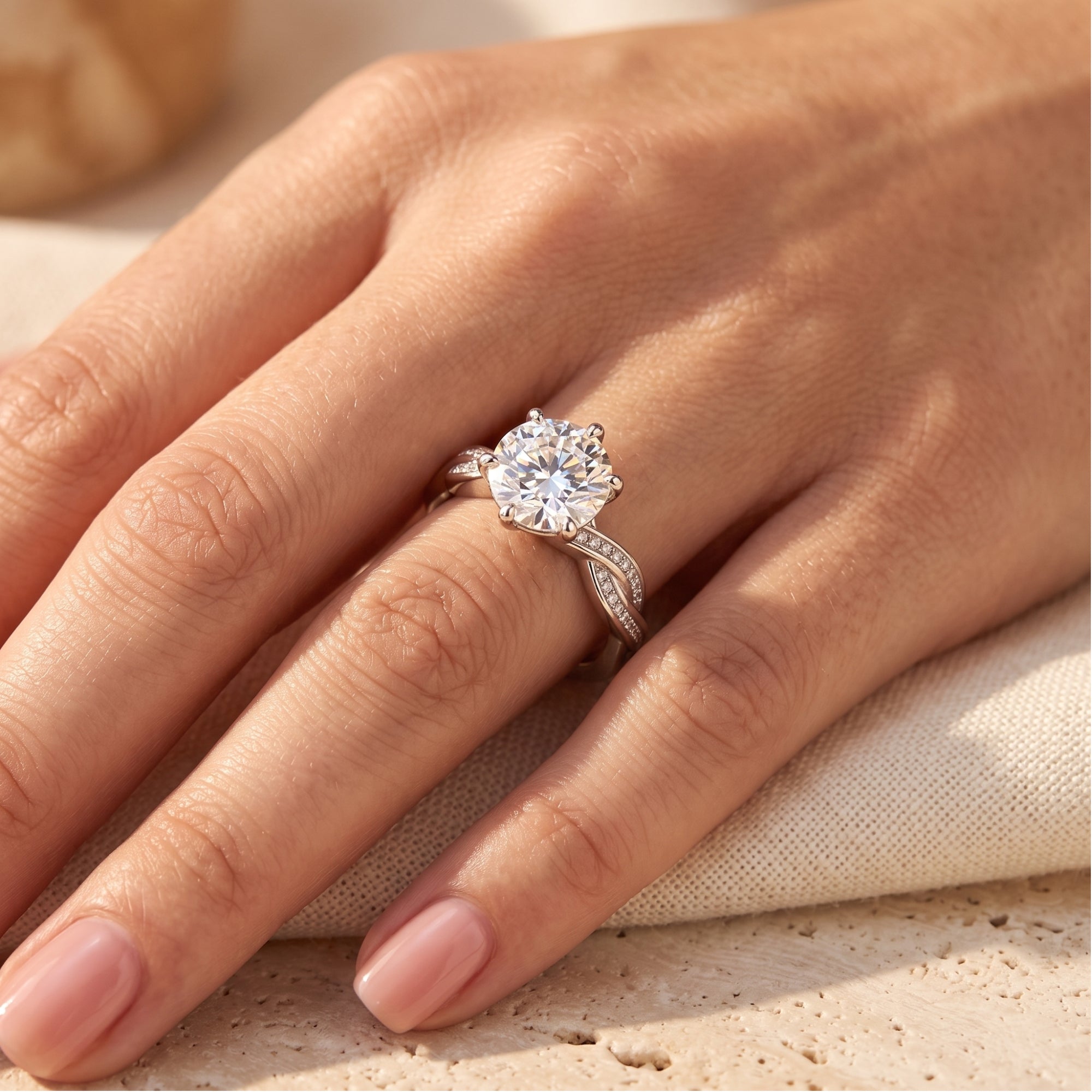 Round-cut simulated diamond promise ring in S925 sterling silver shown on a hand against a neutral background.