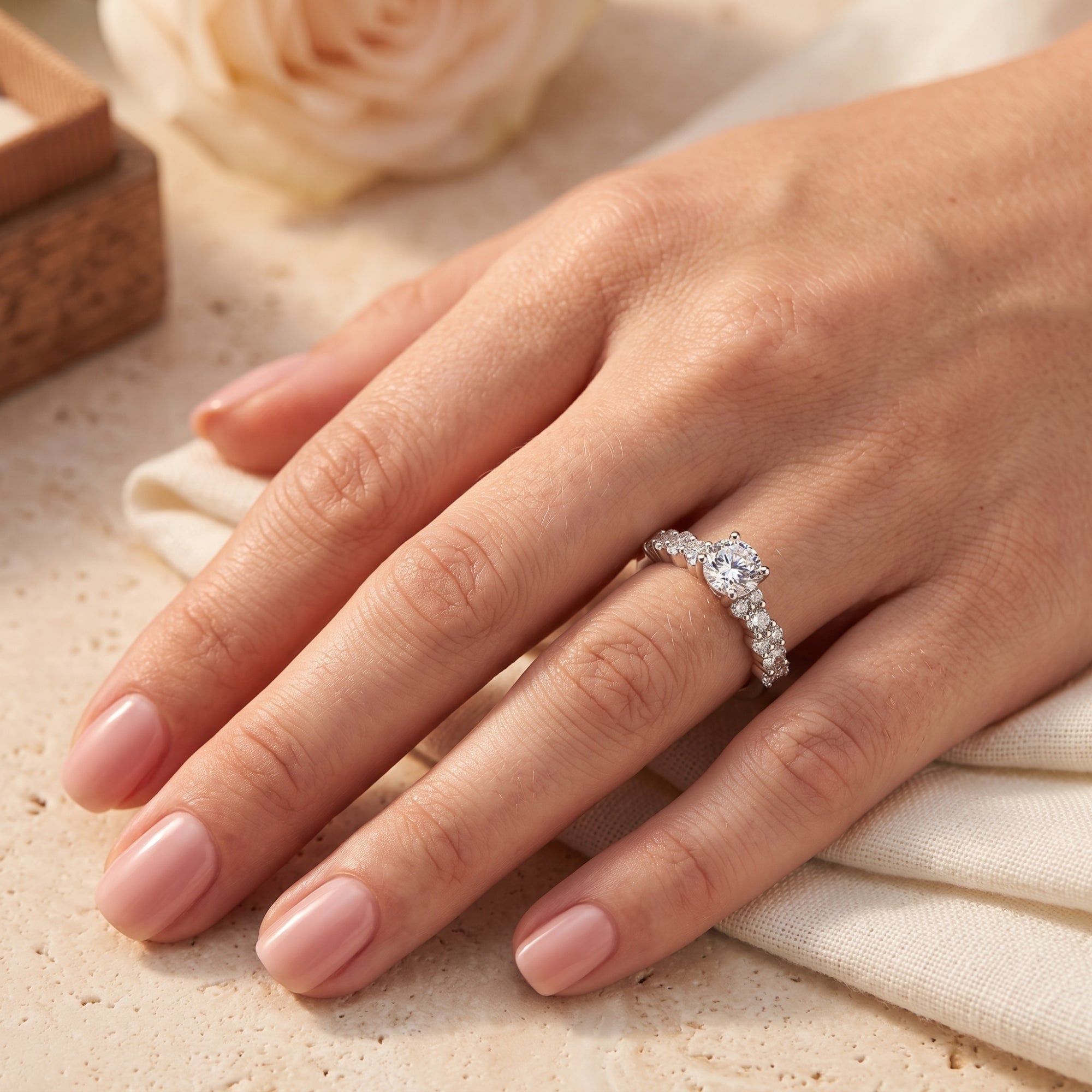 Silver Cassandra solitaire ring shown on a model's finger.