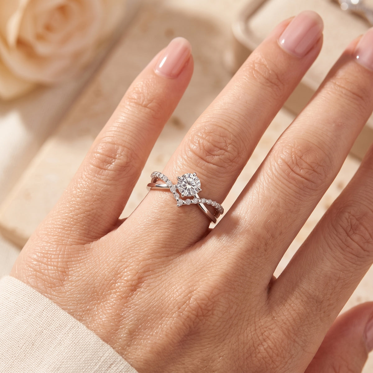 Hand-worn view of the silver chevron split band ring with a round center stone.