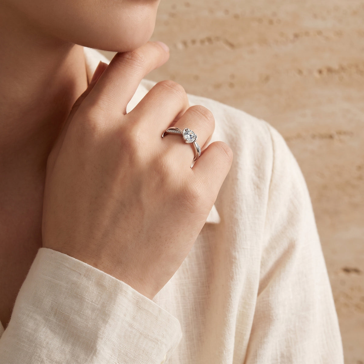 Model wearing the silver heart bypass promise ring, showcasing its low-profile setting and daily wear style.