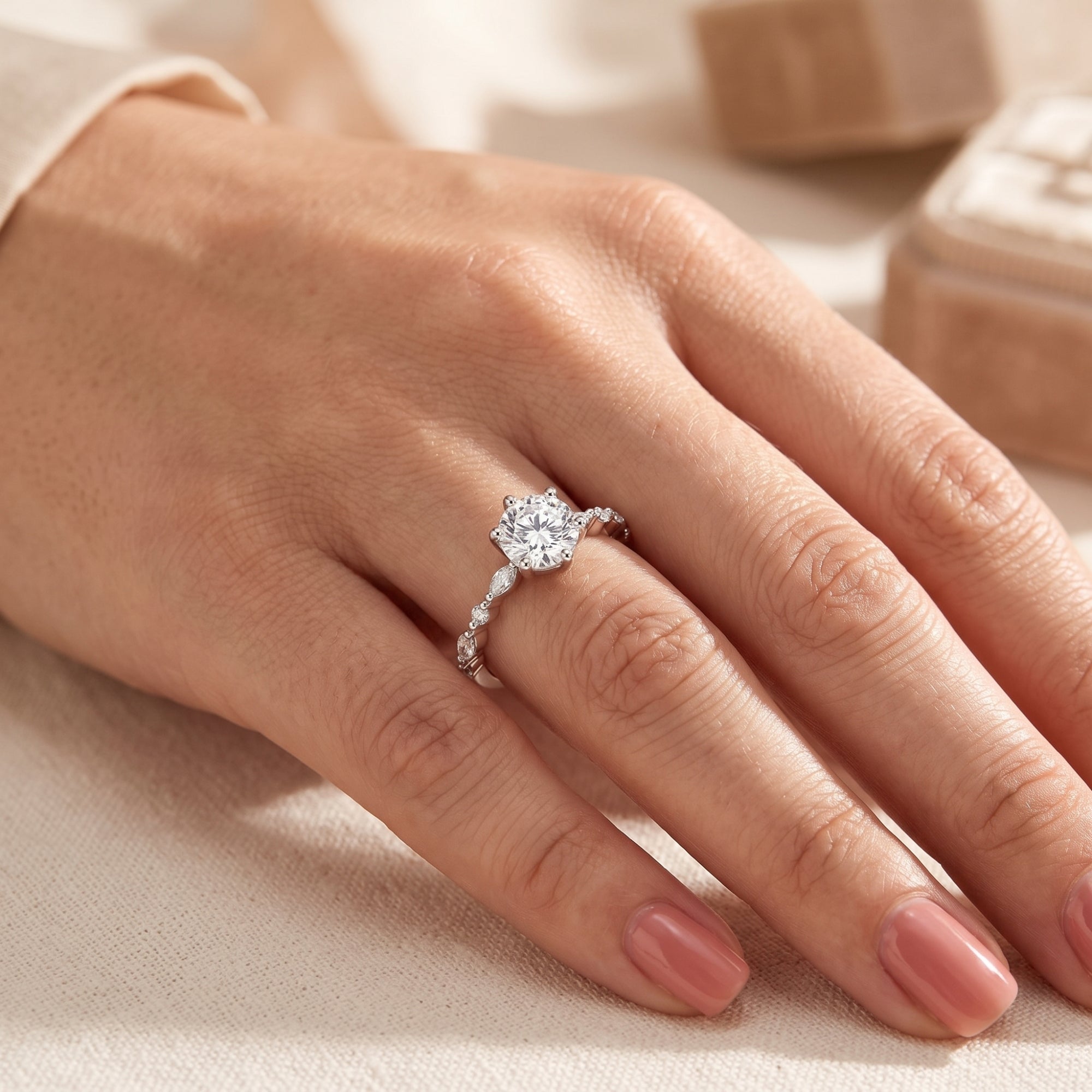Belise sterling silver ring with a round-cut simulated diamond worn on a finger.