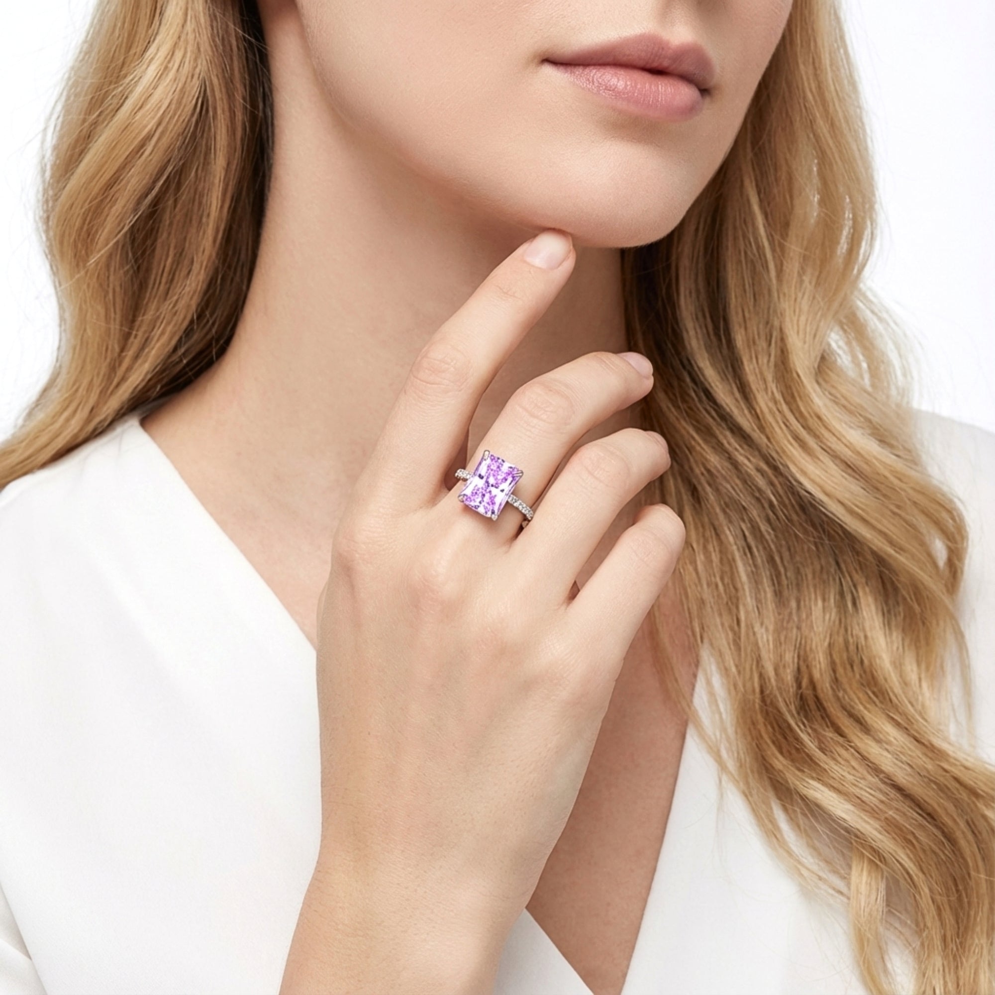 Woman wearing the Cassiopeia radiant cut purple simulated amethyst ring in S925 sterling silver.