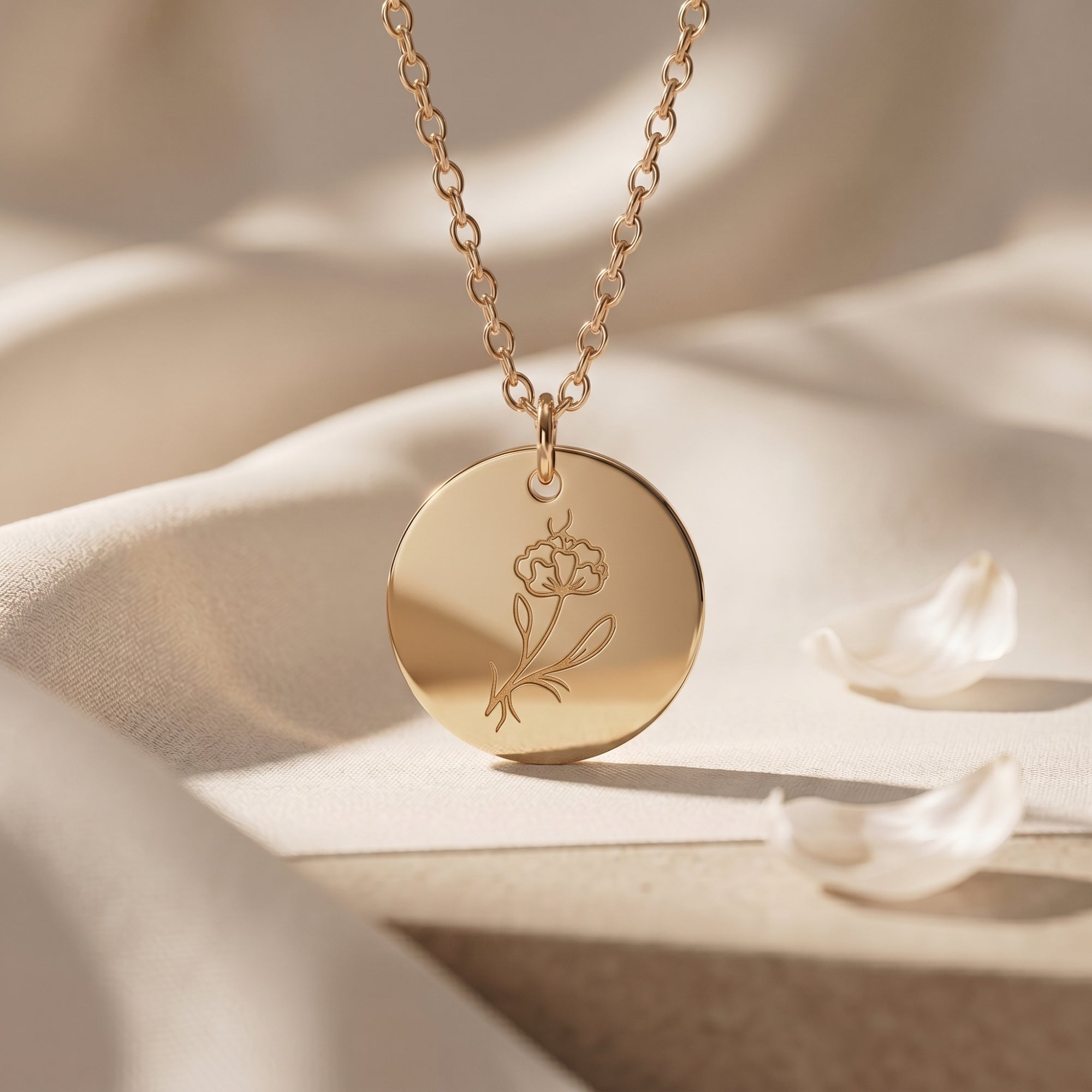 18K gold finish February birth flower necklace with an engraved violet on a dainty circular pendant.