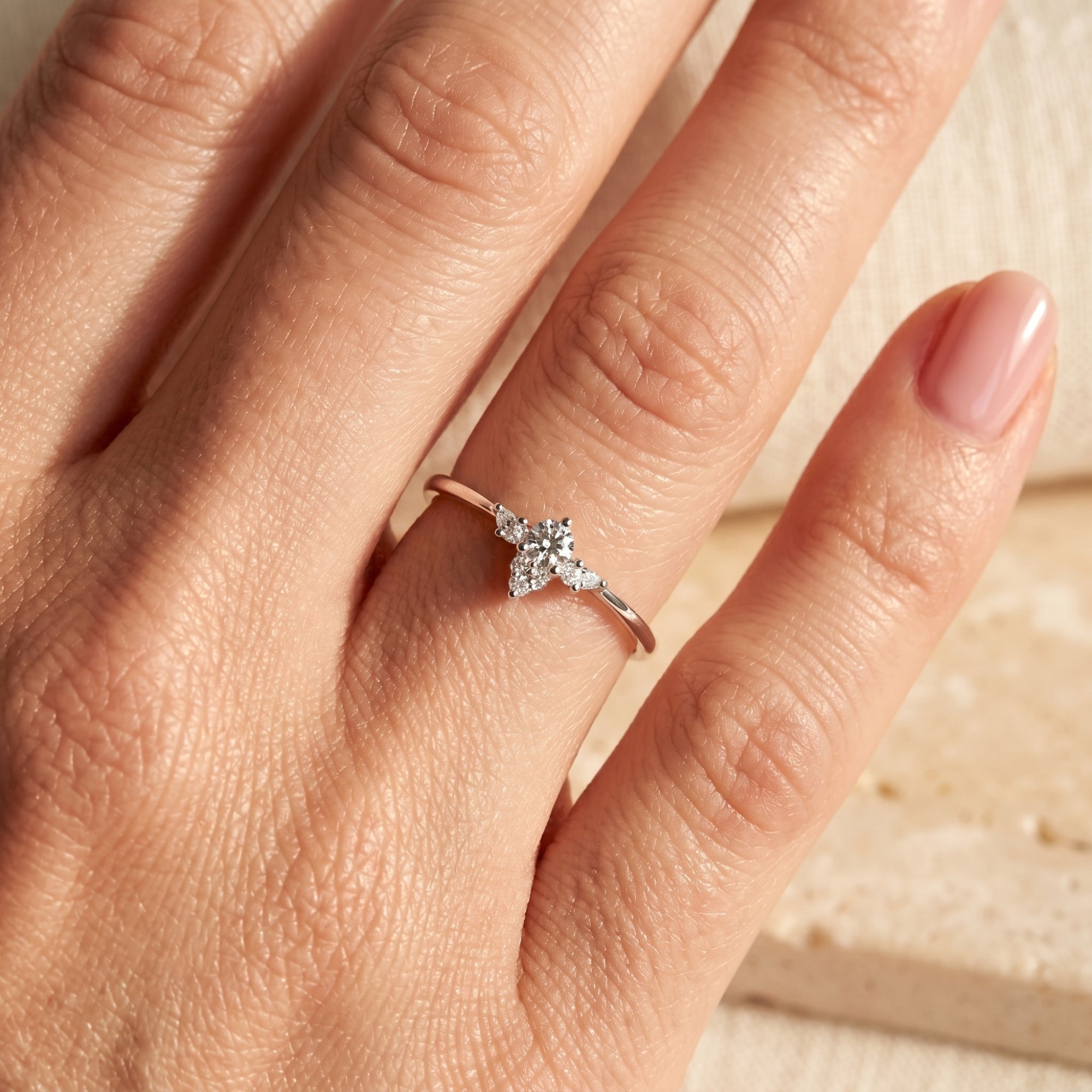 Close-up of the silver Lysianna simulated diamond ring worn on a hand to show scale and sparkle.