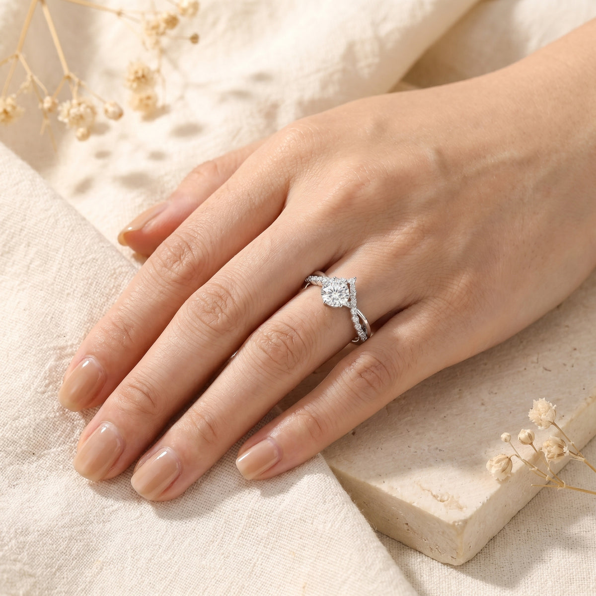 Full hand view of the silver Caladienne 1CT round moissanite promise ring for scale reference.