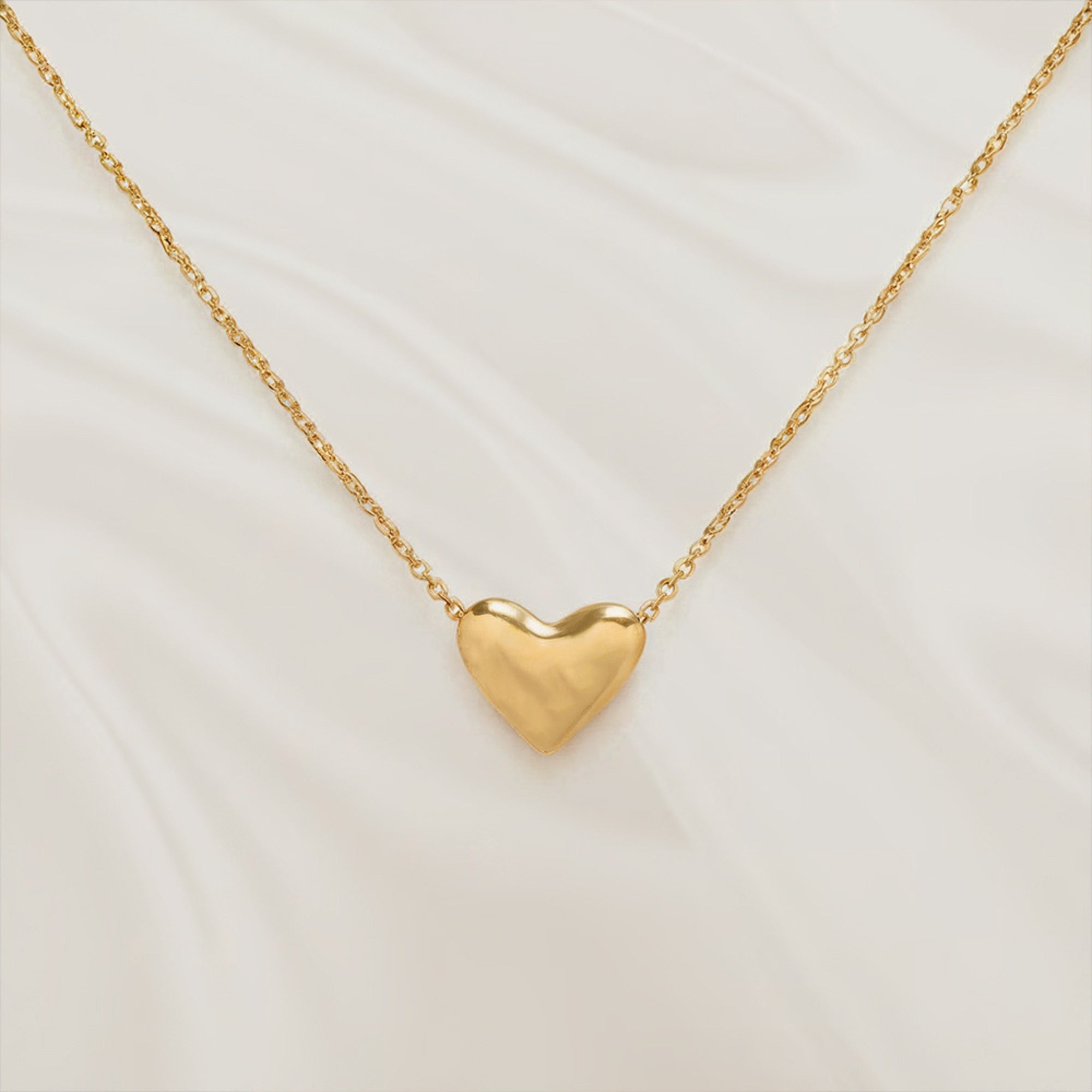 Solid gold heart pendant necklace in 14K or 18K gold.