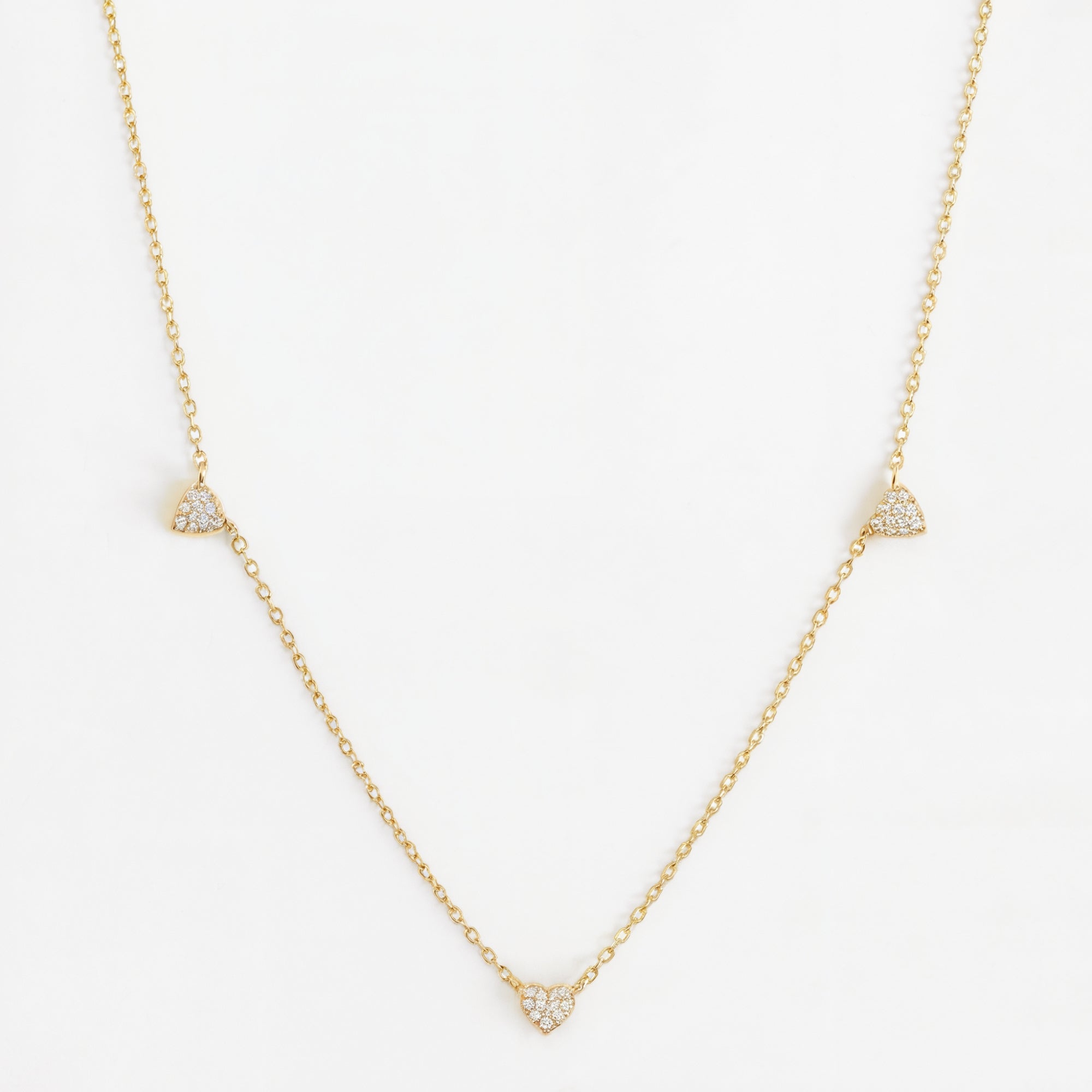 Mini heart chain necklace in solid gold.