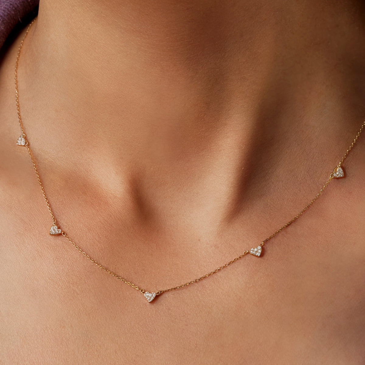6mm by 8mm hearts on the solid gold necklace chain.