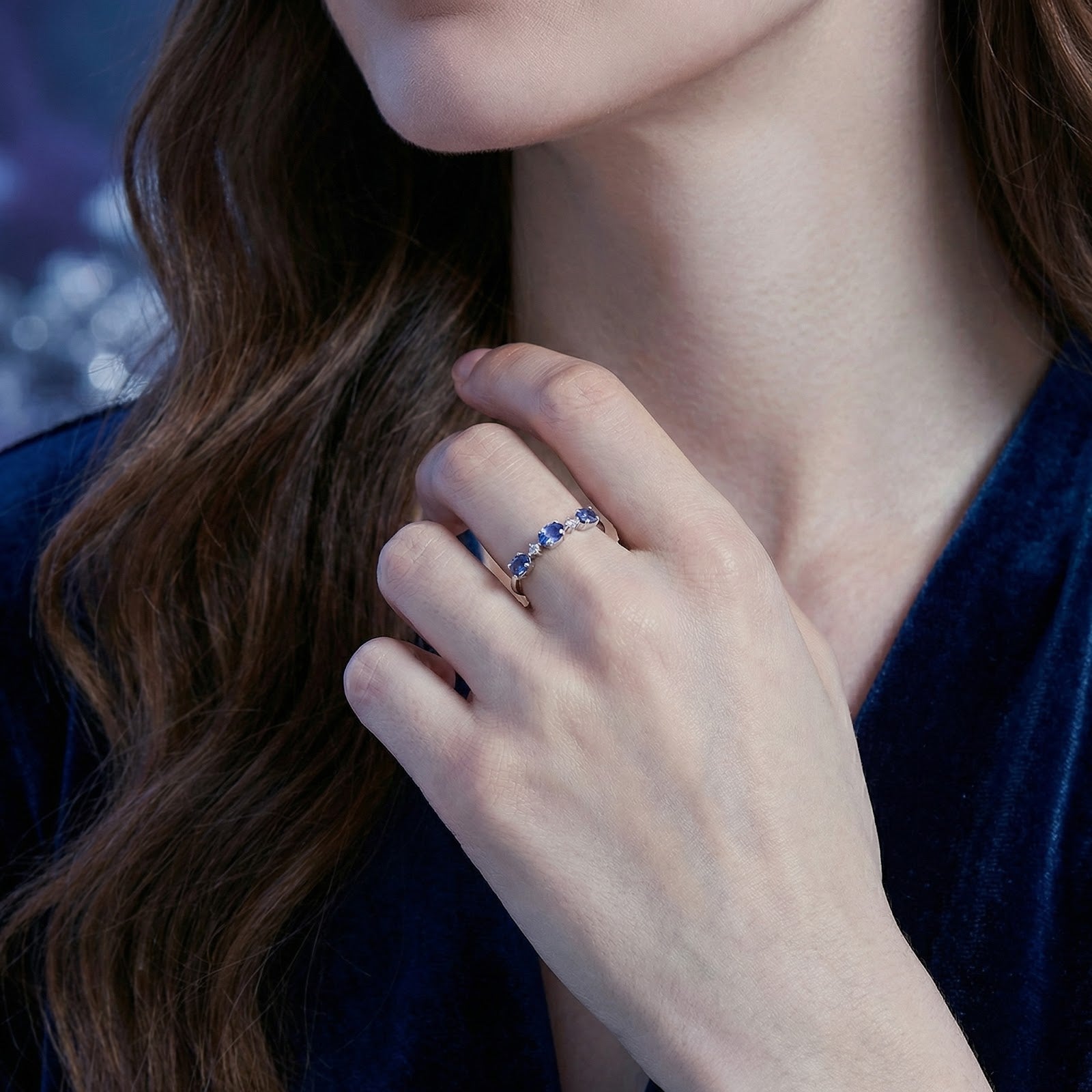 Model wearing the Marissara Trinity Ring in S925 sterling silver with blue simulated tanzanite stones.