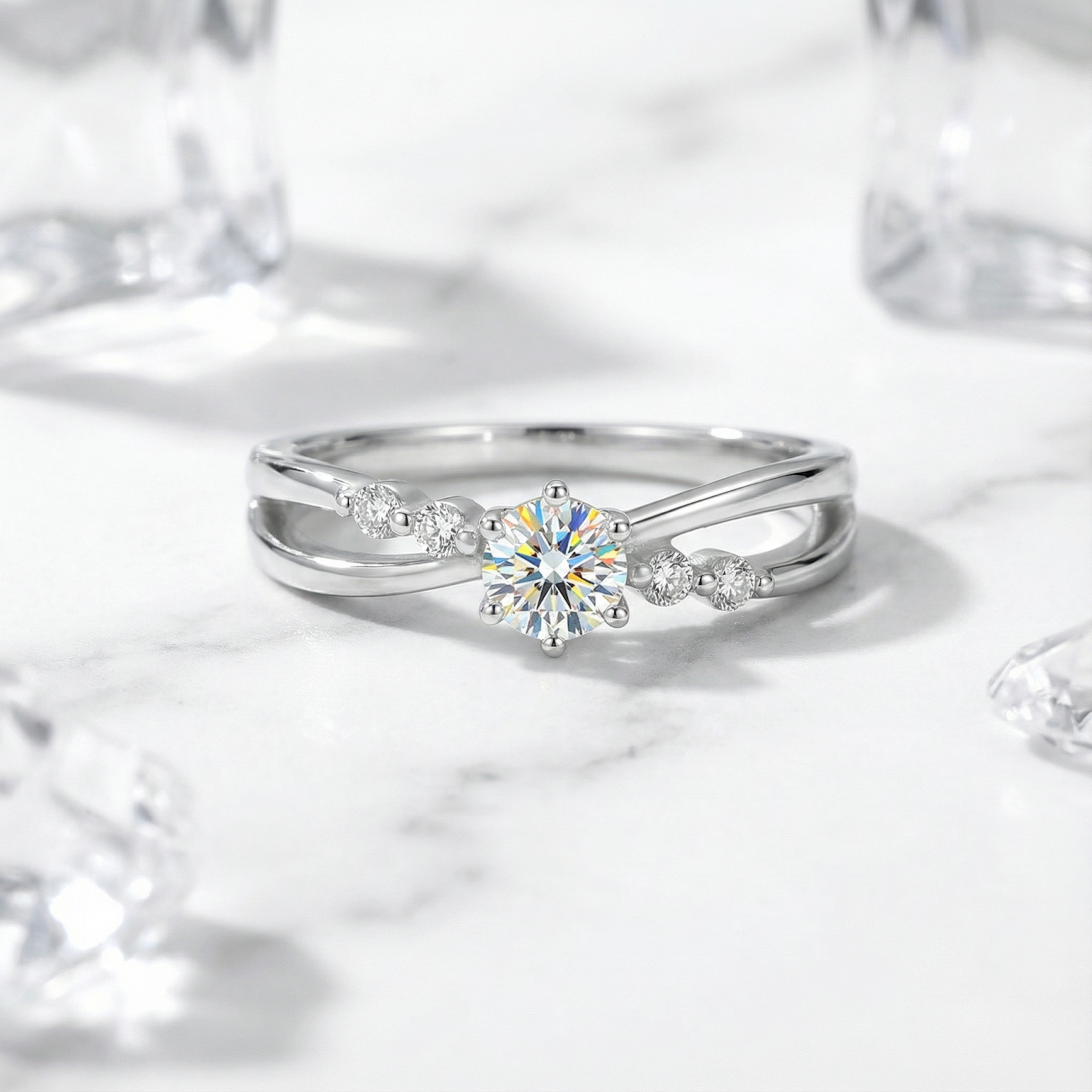 Front view of the Iseltra S925 sterling silver bypass ring with a round-cut simulated diamond on marble.