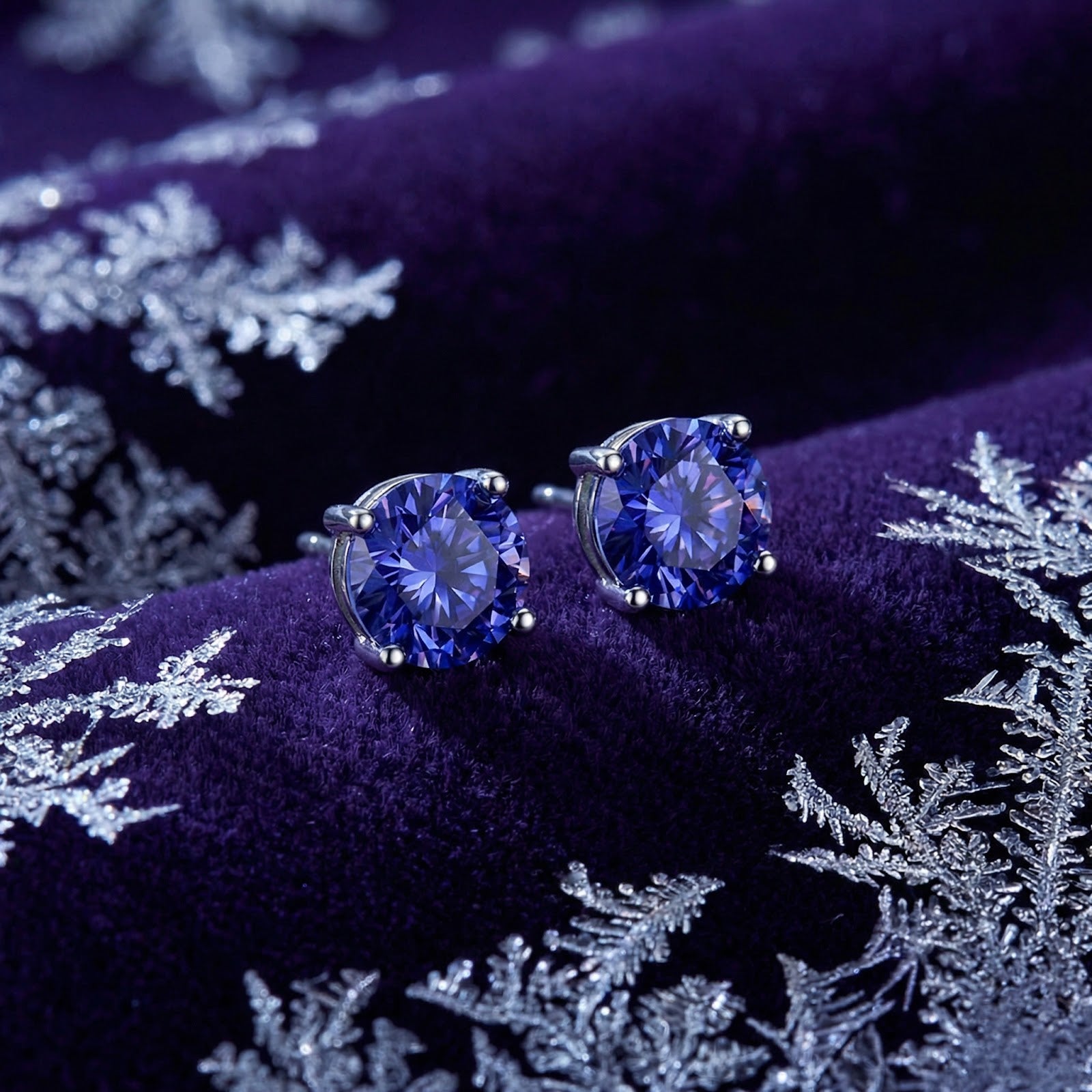 Macro view of round cut simulated tanzanite stones in S925 sterling silver prong settings.
