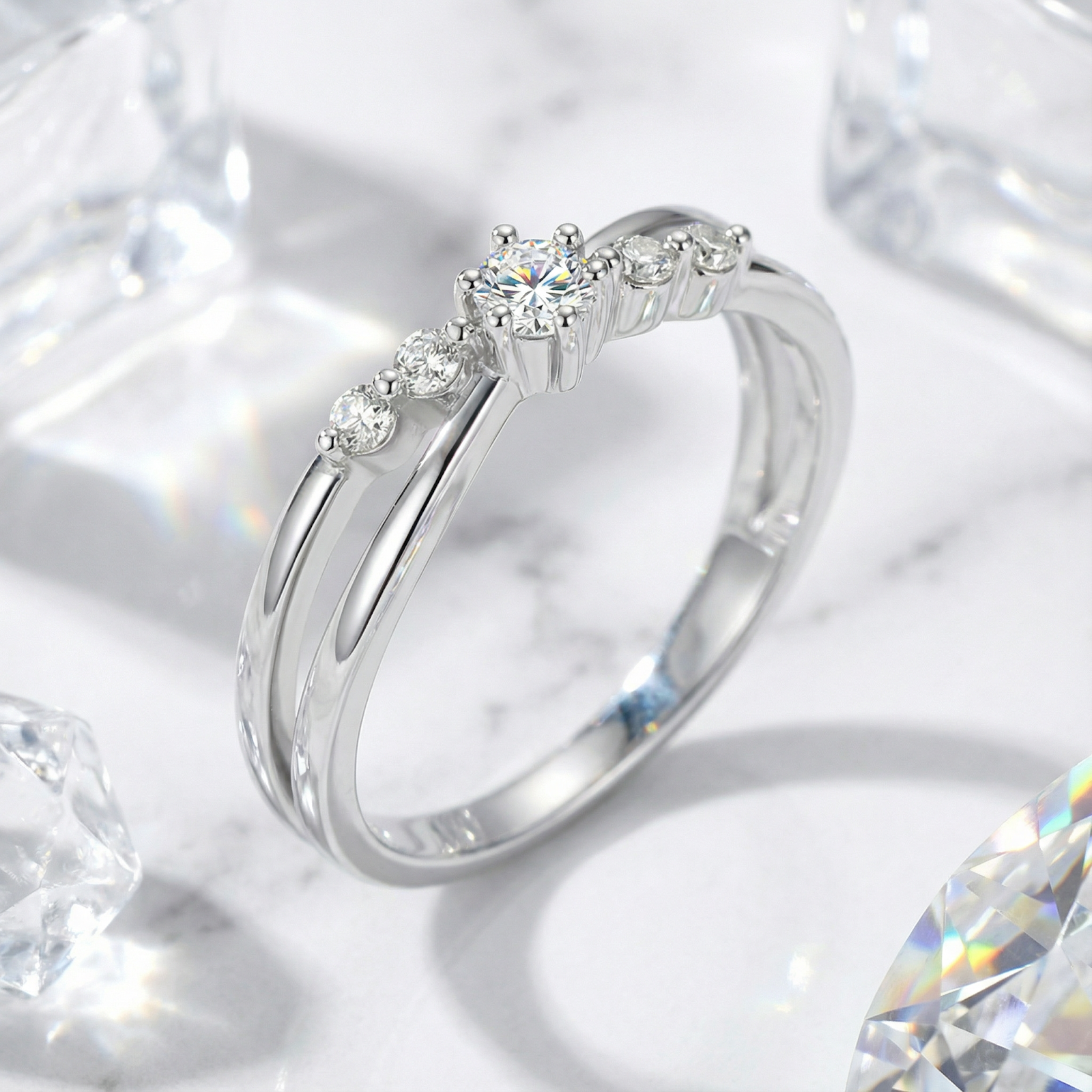 Angled close-up of the Iseltra S925 sterling silver bypass ring showing the round-cut simulated diamond.