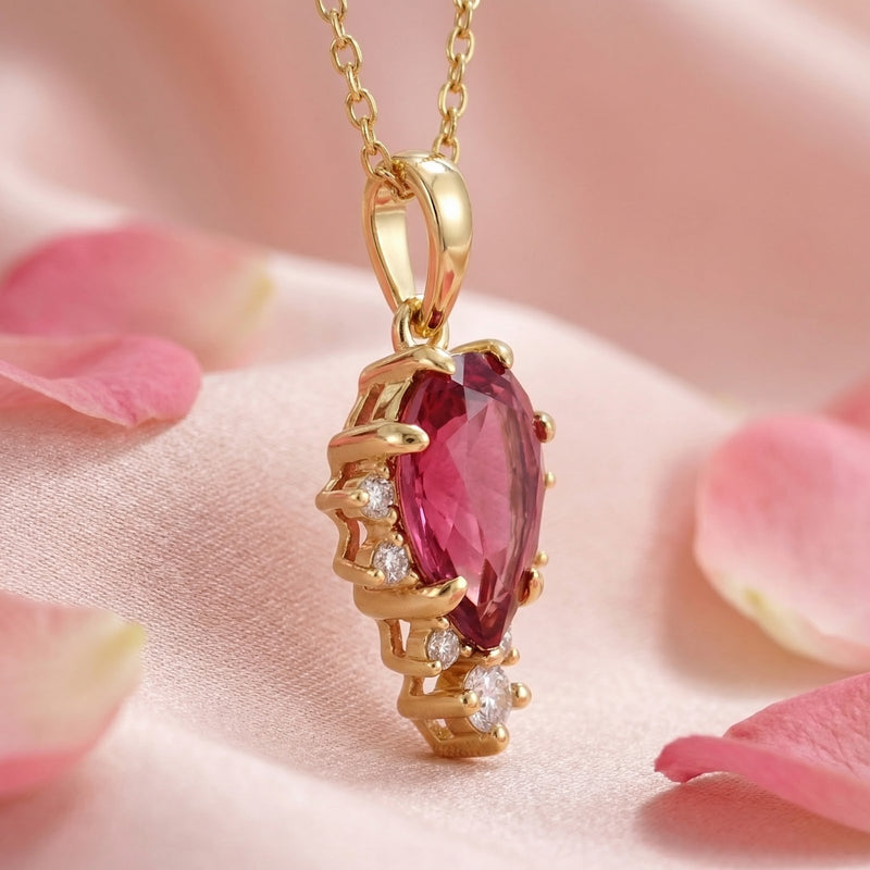 Side view of the pear-cut simulated pink tourmaline pendant in 18K gold vermeil showing the setting.