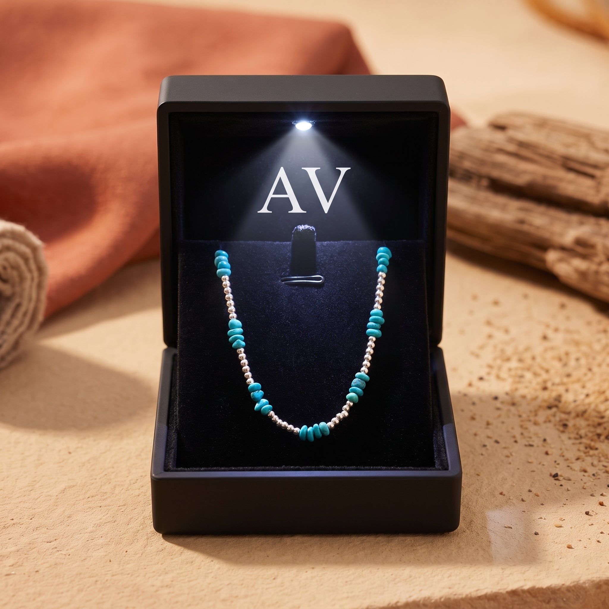 Silver and turquoise bead necklace presented in a black LED-lighted jewelry gift box.