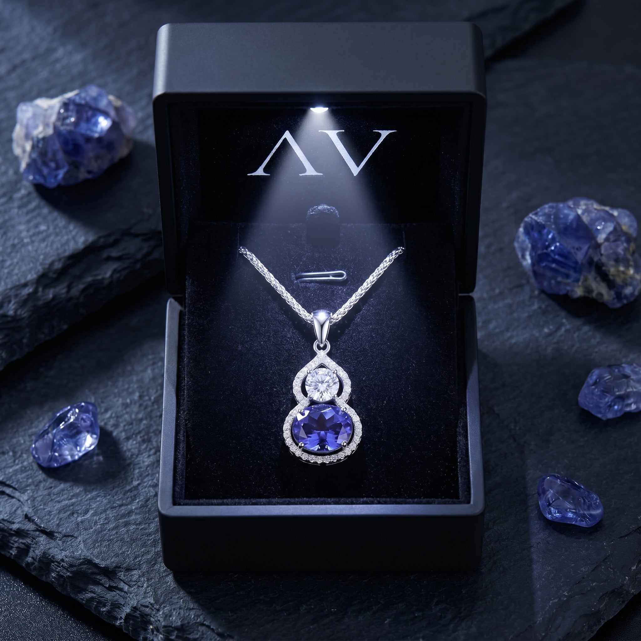 The Amellina tanzanite necklace displayed in a premium black LED-lighted jewelry gift box.