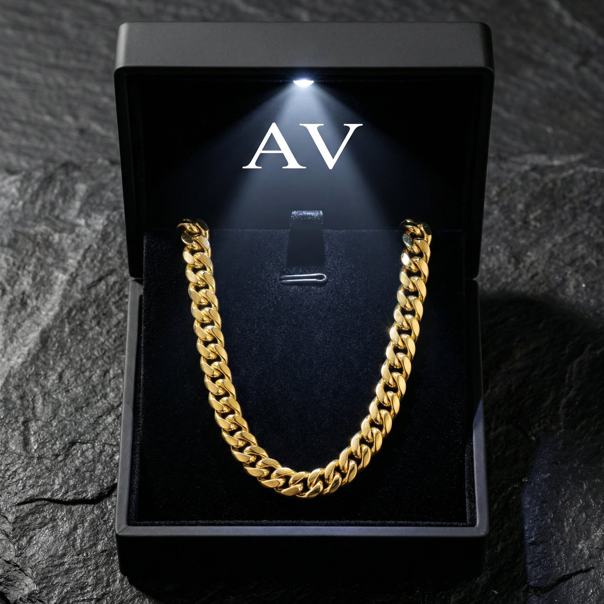 10mm gold Titan Cuban chain presented in a black LED-lit jewelry box with AV branding.