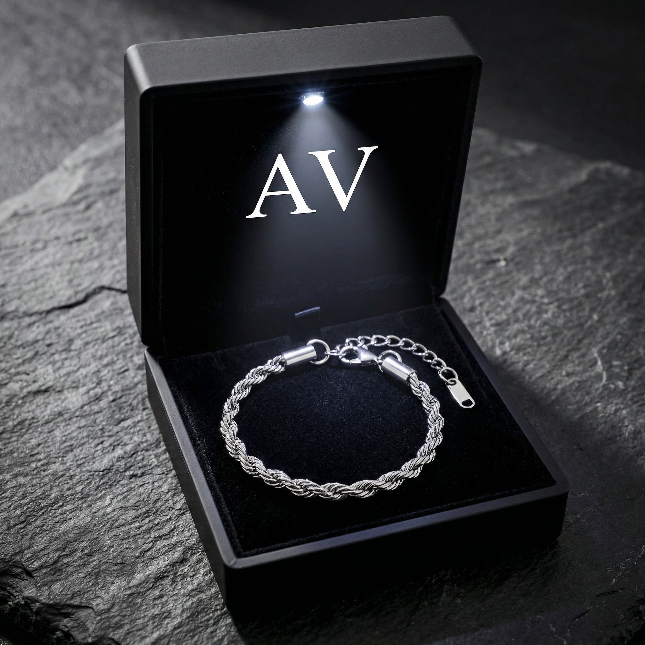 Silver stainless steel mariner rope bracelet in a black LED-lit gift box with AV logo on stone.