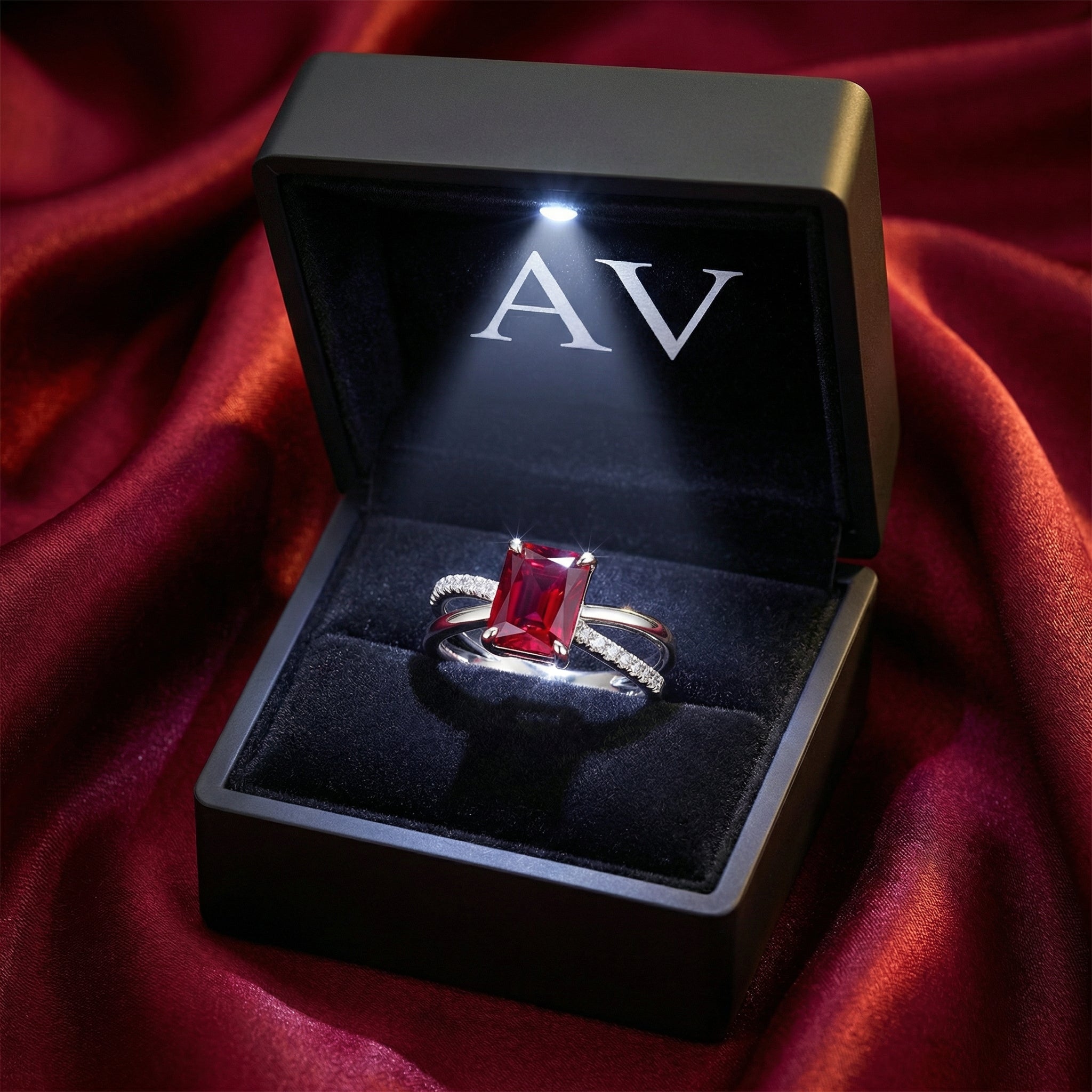 Radiant cut simulated ruby sterling silver ring inside a black LED-lit jewelry presentation box.