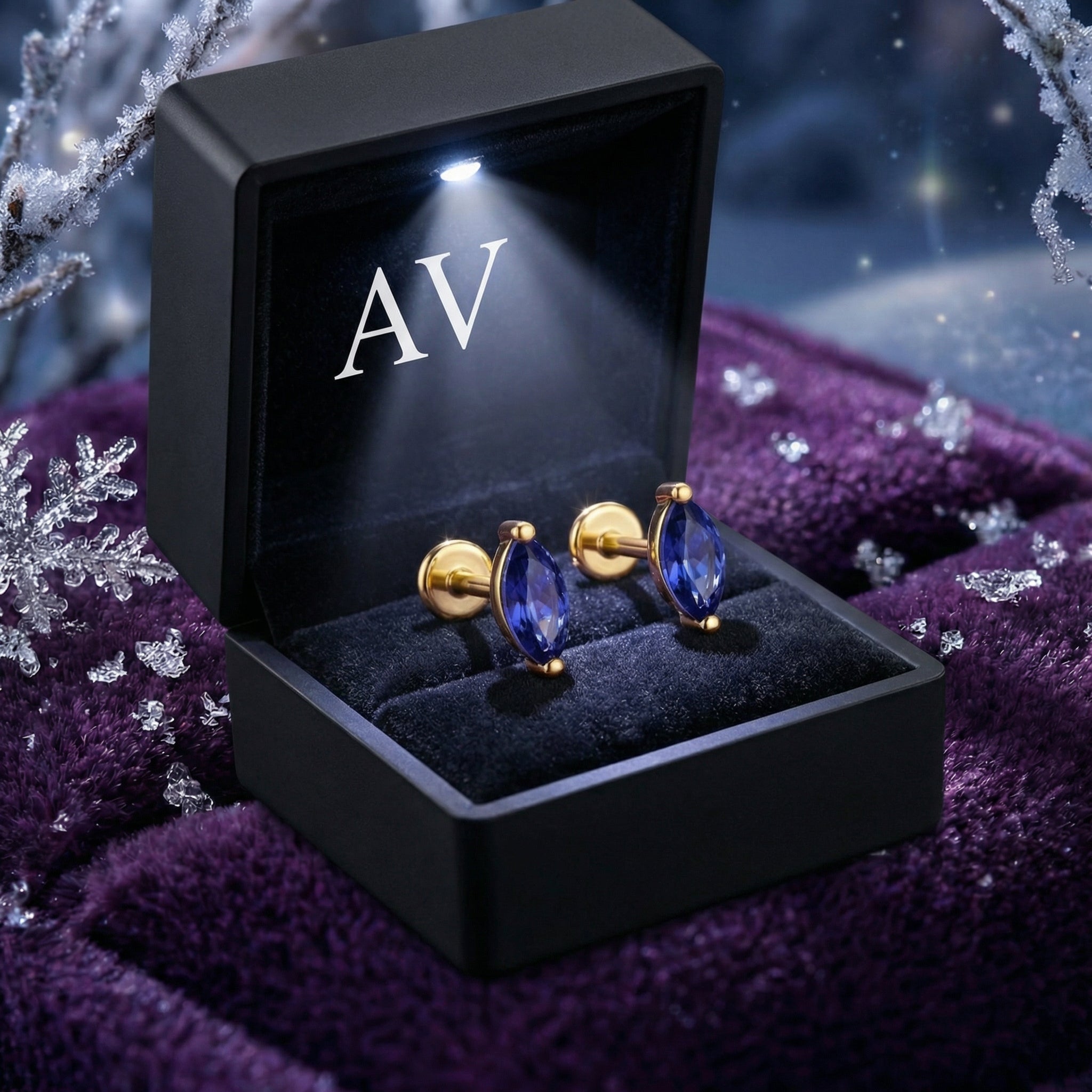 Marquise simulated tanzanite gold vermeil earrings in a black lighted AV jewelry gift box.