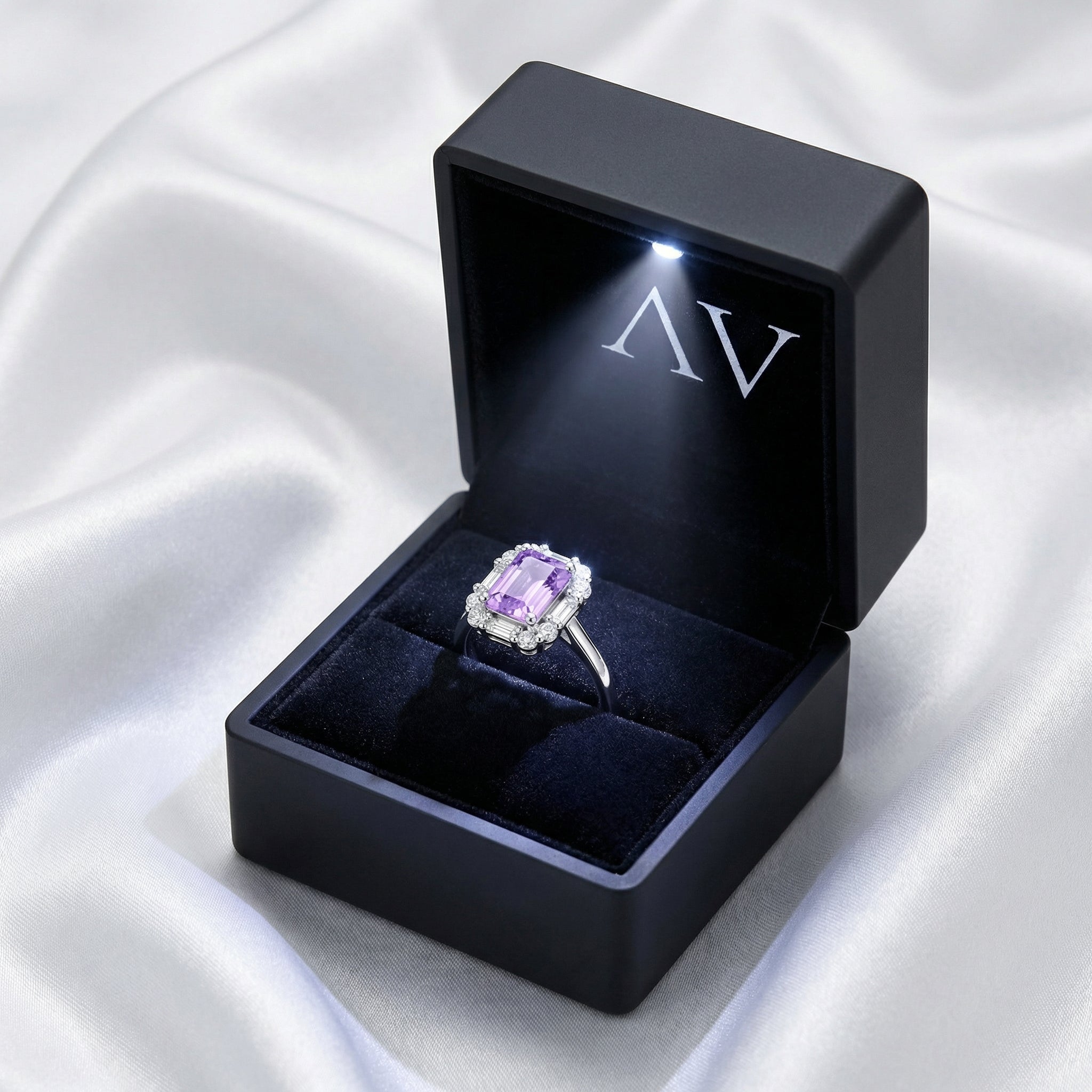 S925 sterling silver emerald cut amethyst halo ring inside a black LED-lighted jewelry gift box.