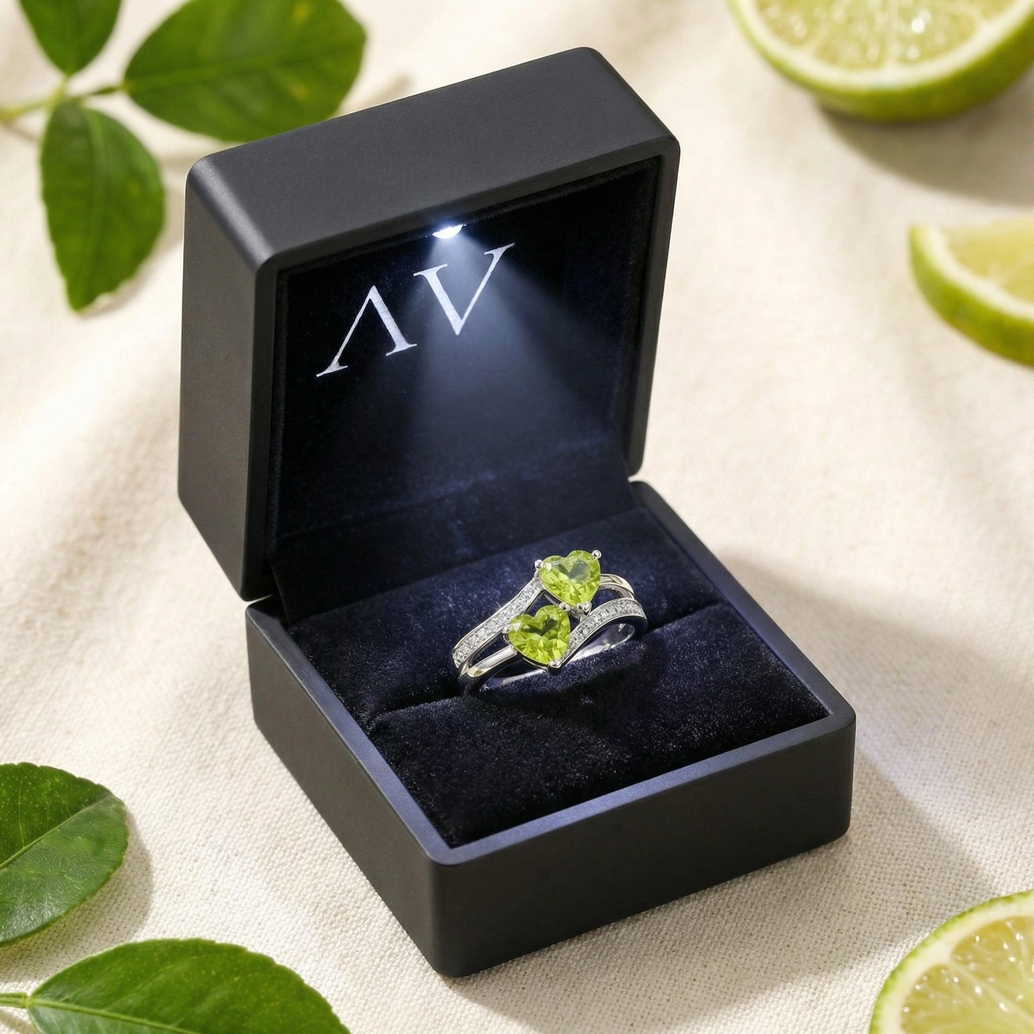 Valisara sterling silver simulated peridot bypass ring in a black LED-lit jewelry box with a velvet interior.