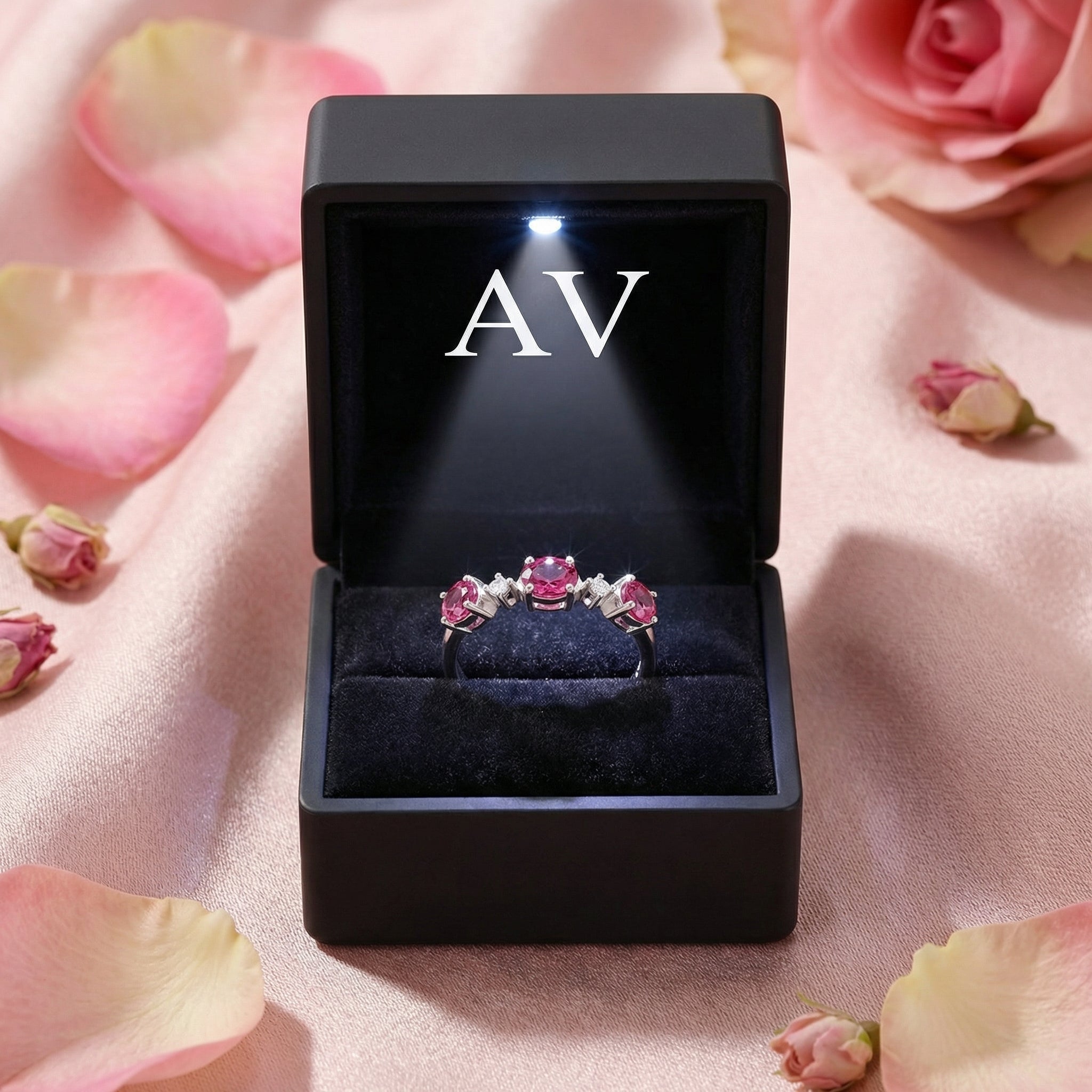 Aurelissa S925 sterling silver bypass ring presented in a black LED-lit gift box with the AV logo.