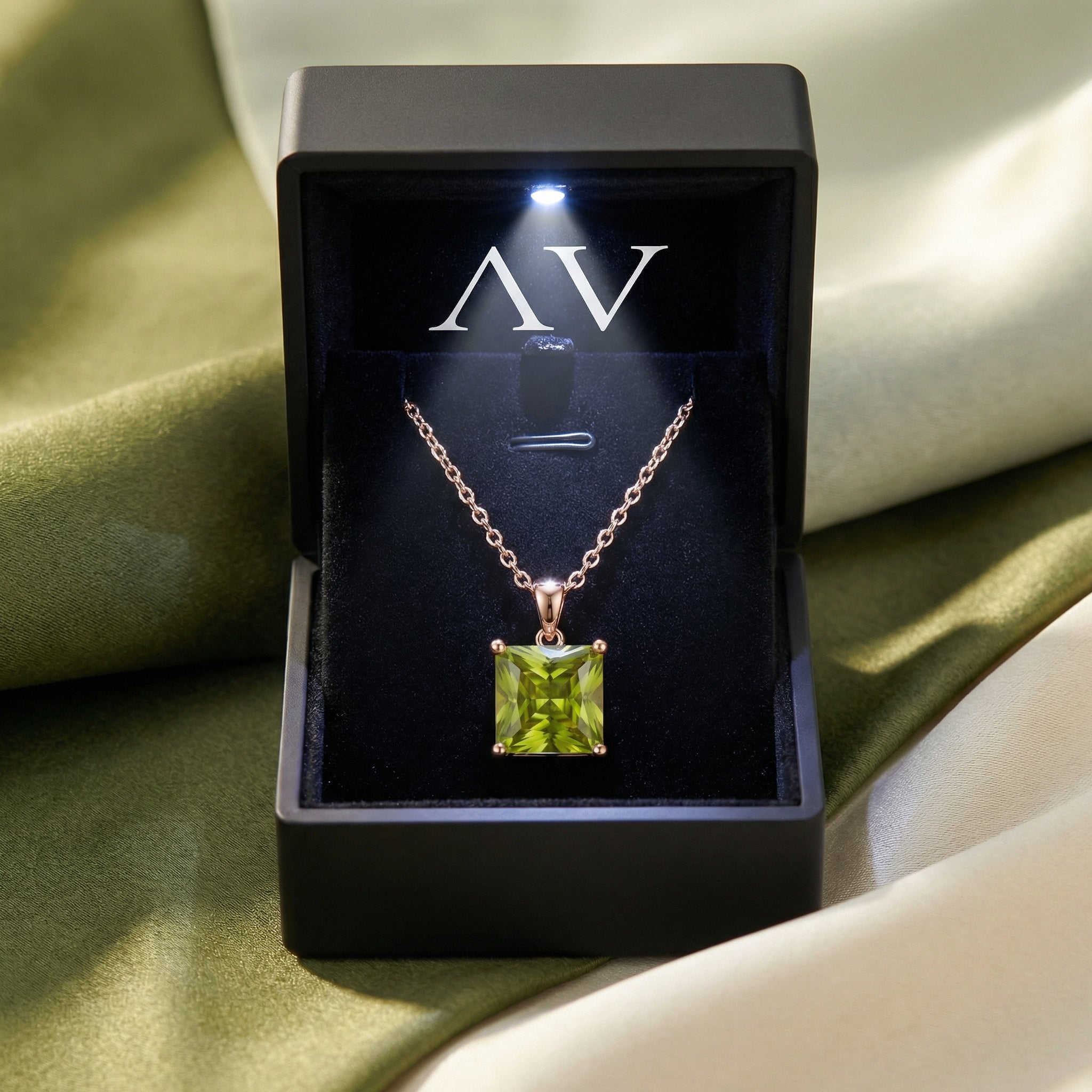 Princess cut natural peridot necklace in 18K rose gold vermeil presented in a lighted black AV jewelry gift box.
