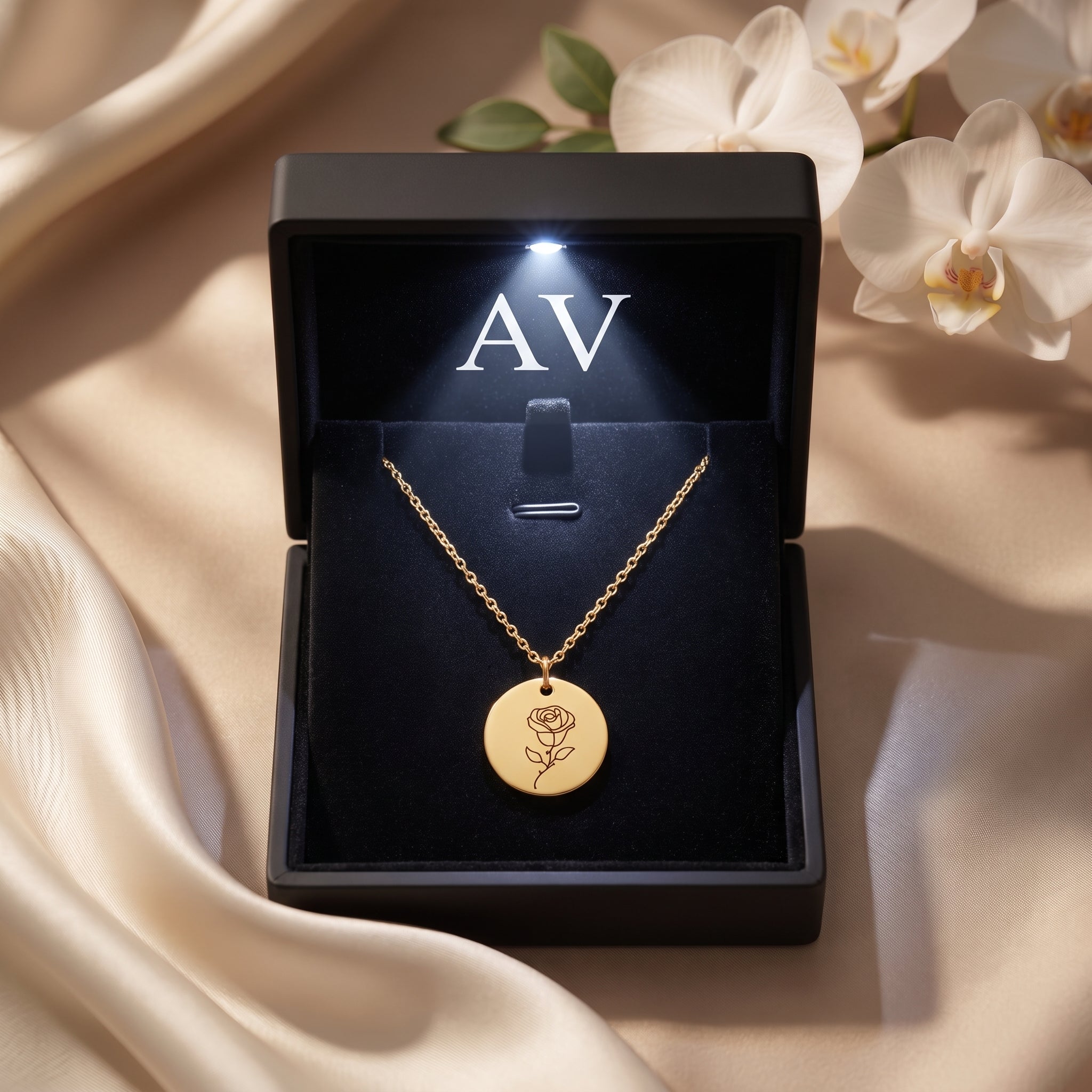 18K gold finish birth flower necklace presented in a luxury black gift box with an integrated LED light.