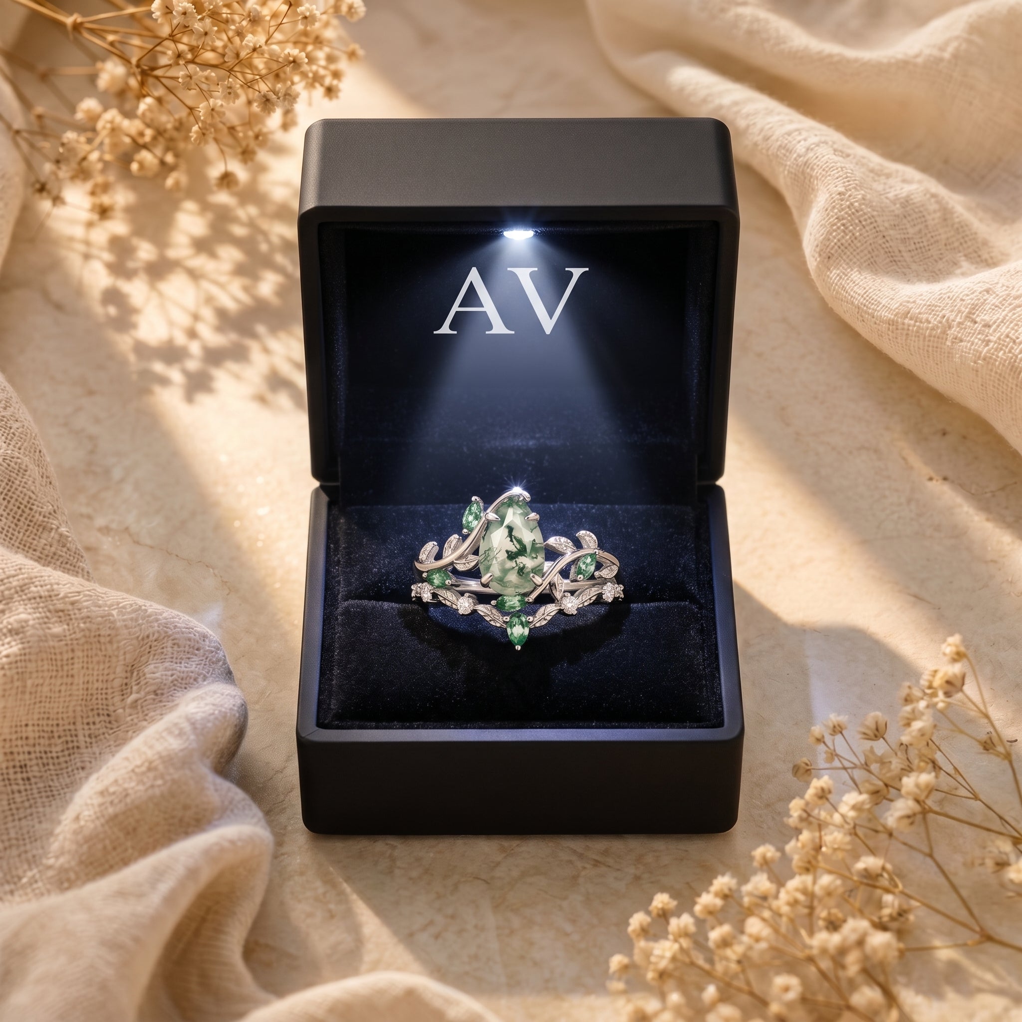 Silver moss agate vine ring set presented in a black light-up jewelry box with the AV logo.