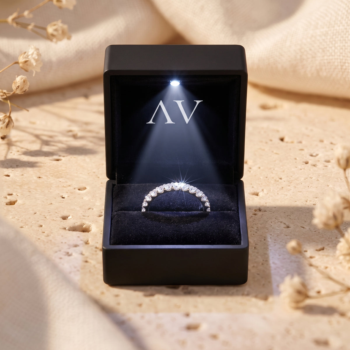 Sylvienne moissanite pave ring presented in a premium black LED-lighted jewelry box.