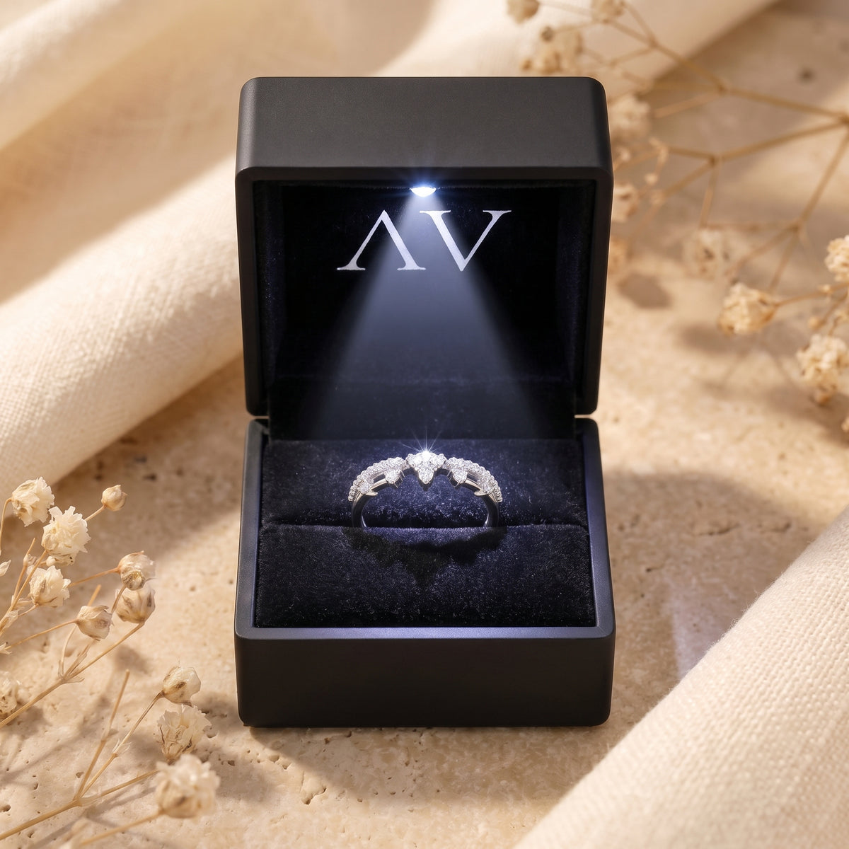 Silver Ismerelle tiara ring displayed in a black LED-lit jewelry box for a premium presentation.