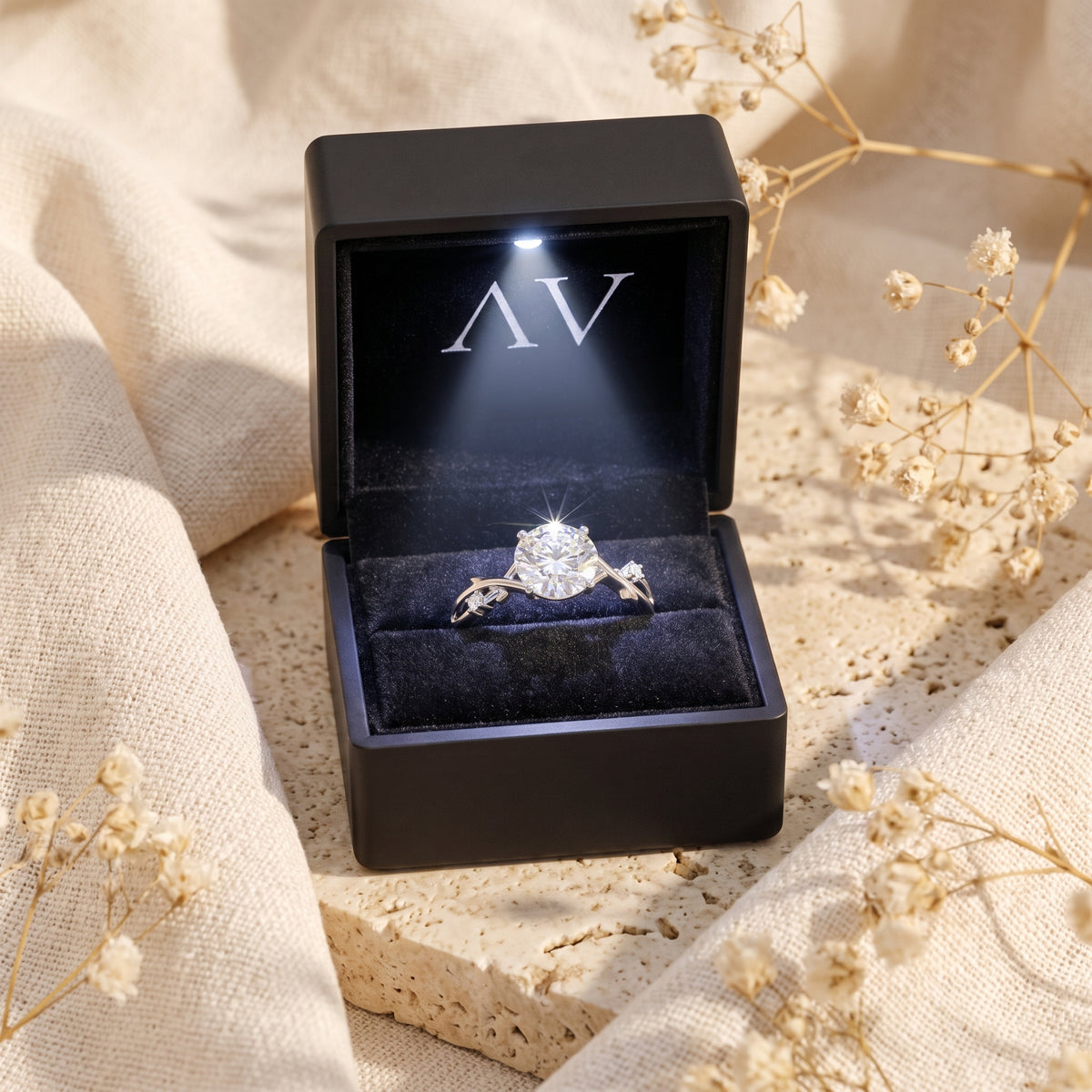 The Sylvella moissanite engagement ring presented in a premium black LED-lit jewelry gift box.