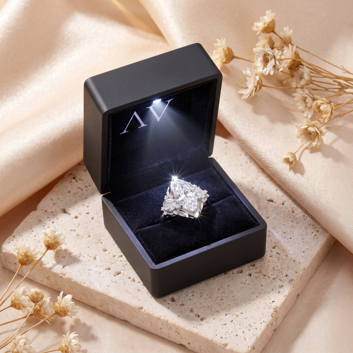 Sterling silver marquise simulated diamond ring in a lighted gift box.