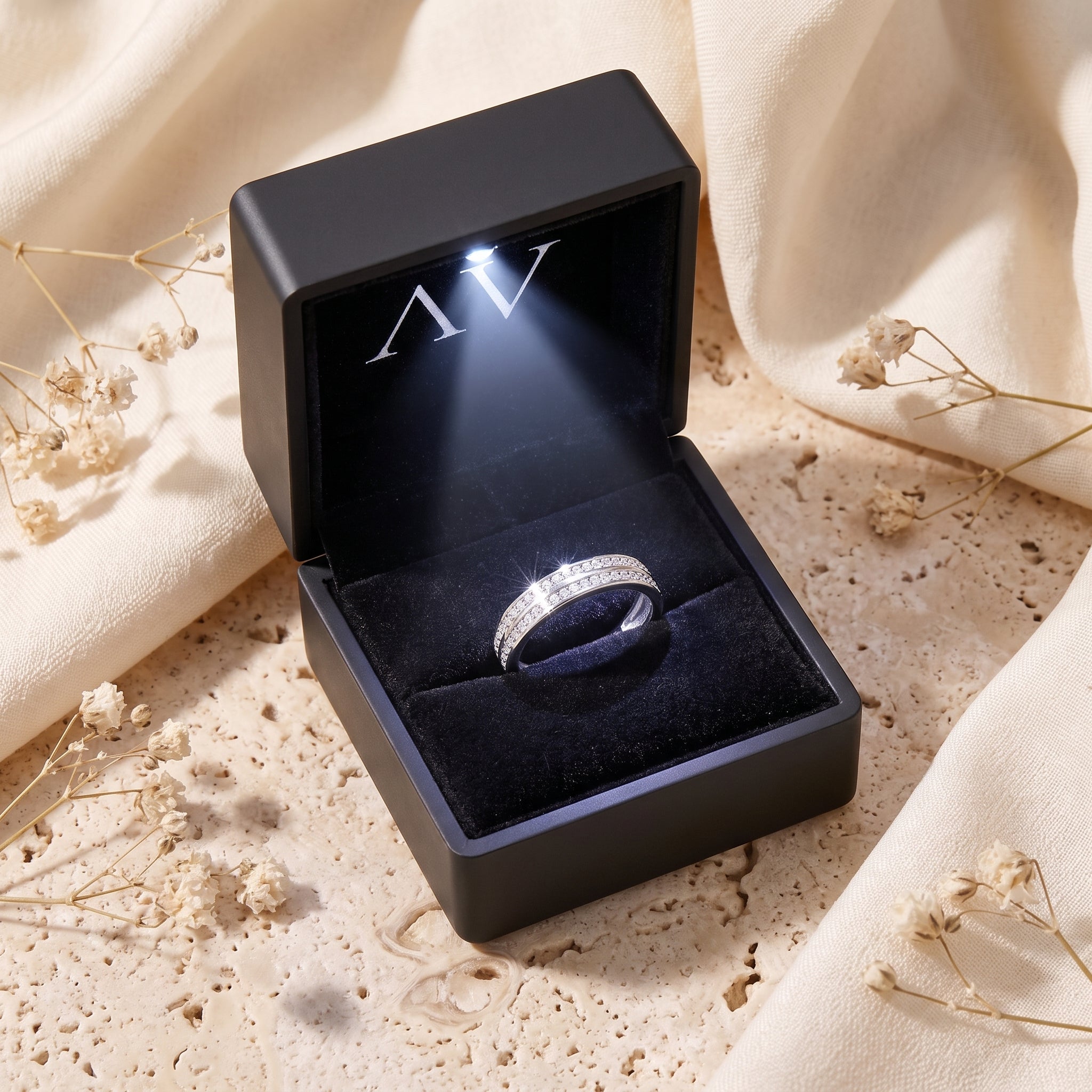 The Margaux double-row pavé sterling silver ring inside an open black LED-lit jewelry presentation box.