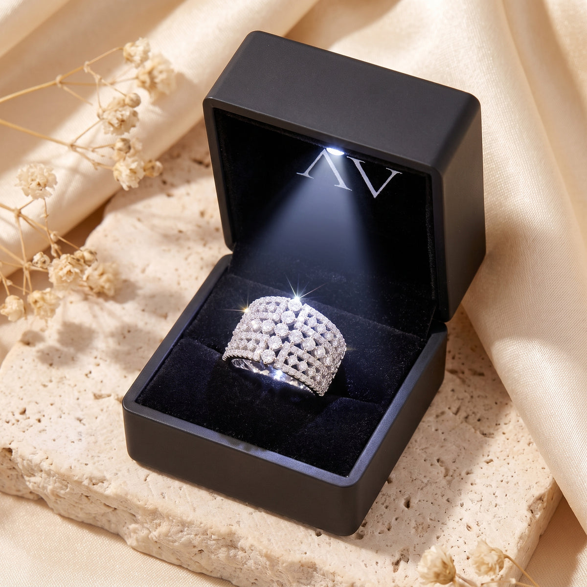 Eleonora silver statement ring displayed in a black illuminated jewelry gift box.