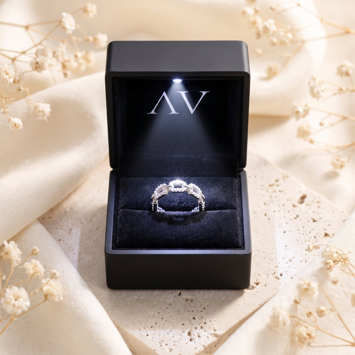 S925 silver pavé link ring inside a black LED-lit presentation box.