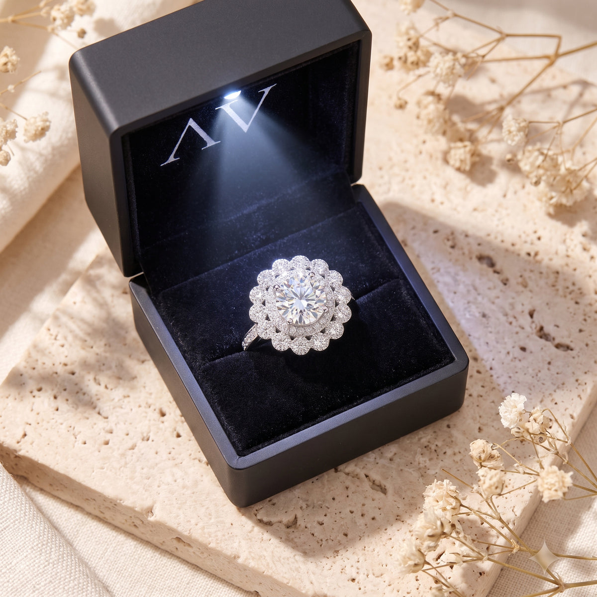 Sterling silver Elysetta ring inside a black velvet-lined gift box with an integrated LED light.