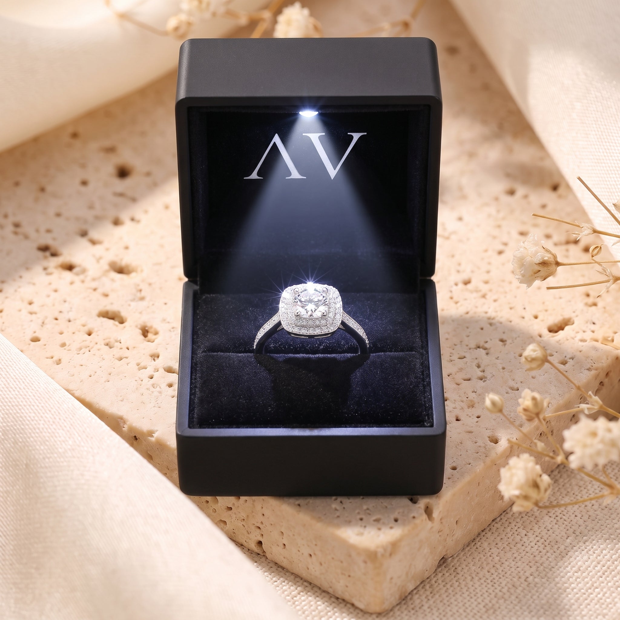 Sterling silver Juliette ring with round cut stone in a black LED-lit jewelry gift box.