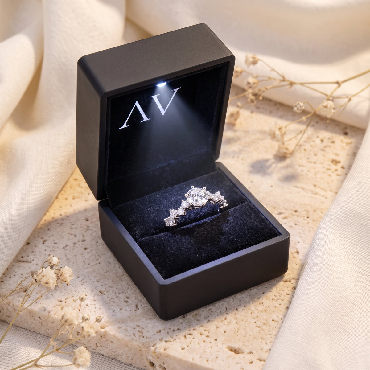 Silver Aura tiara ring in a black LED-lit jewelry gift box.