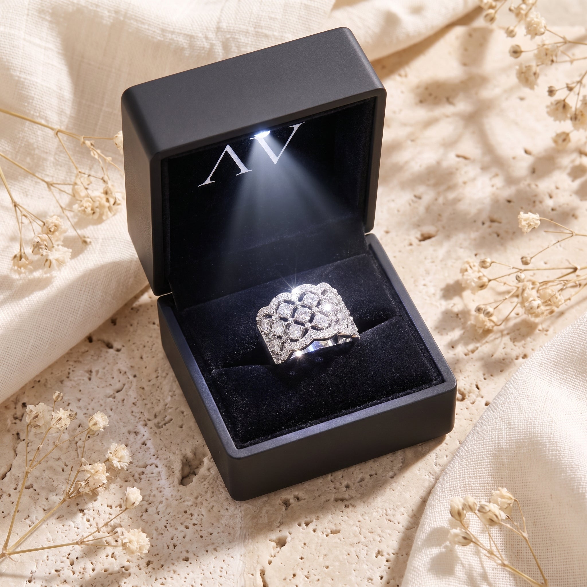 Carisienne silver simulated diamond ring in a black lighted gift box.