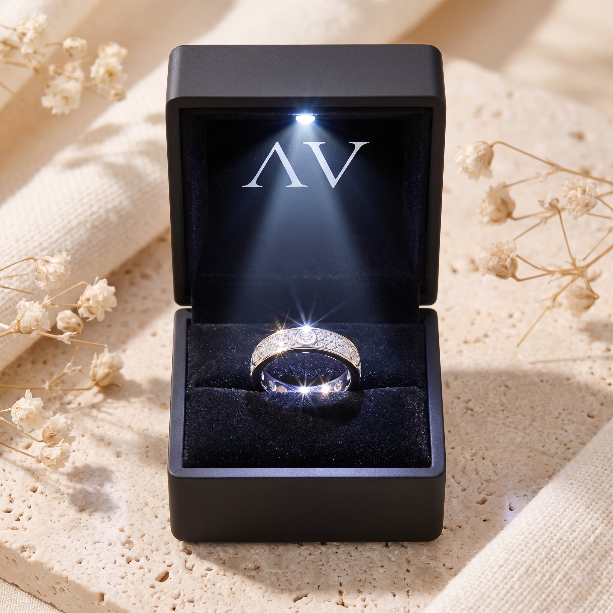 Sterling silver pavé ring inside a black LED-lit jewelry presentation box.