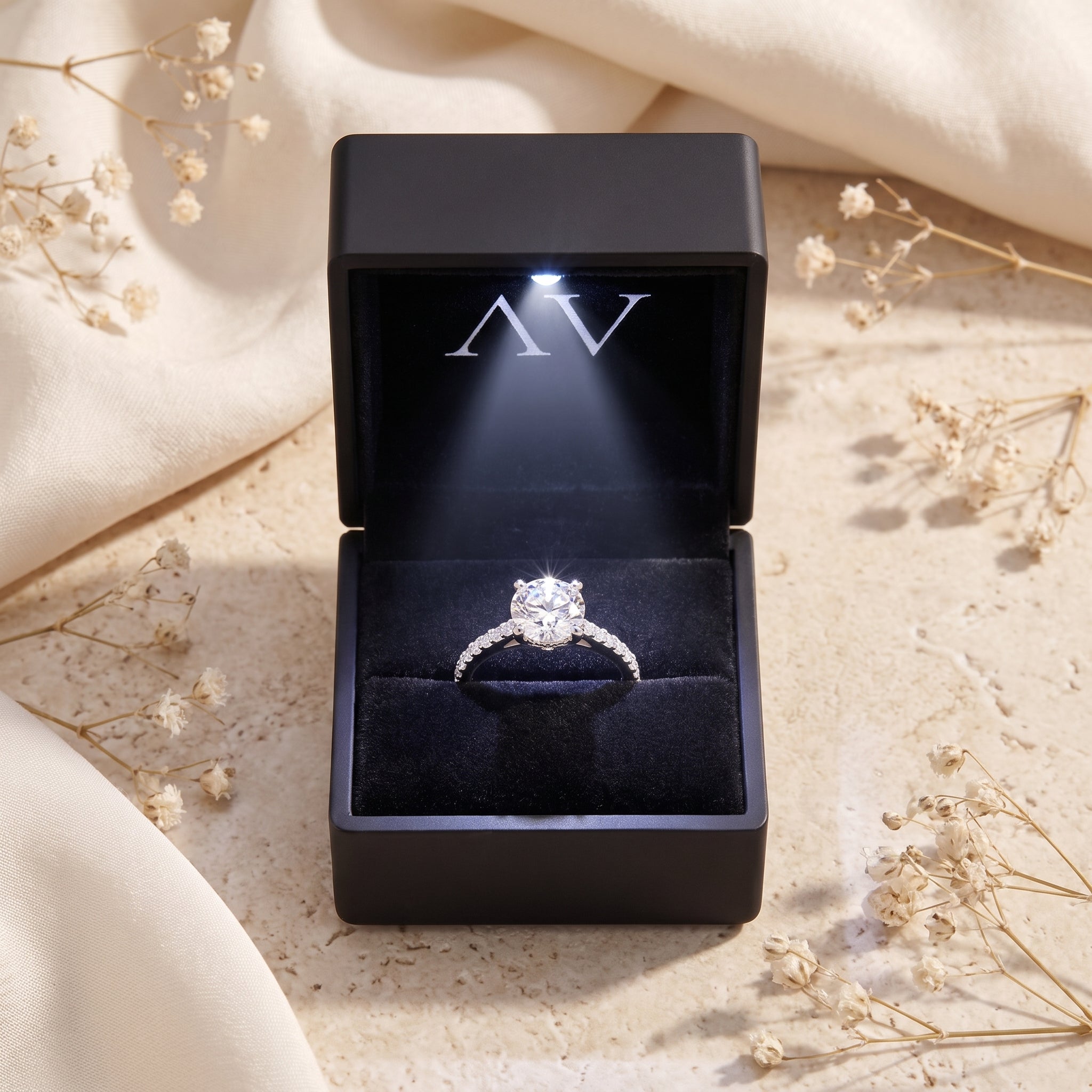 Josephine simulated diamond ring in sterling silver presented in a lighted black gift box.